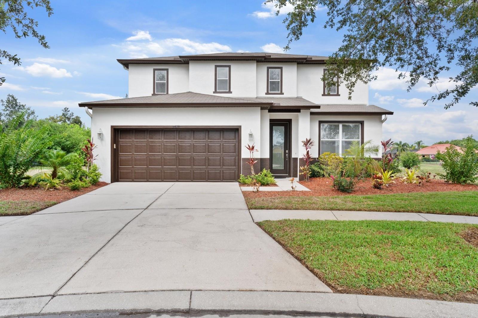 FULLY RENOVATED | BRAND-NEW ROOF | LOW $100 HOA | POND VIEWS!! Welcome to this beautifully renovated 3-bedroom, 2.5-bath residence nestled on a quiet cul-de-sac within the sought-after Harbour Isles community. Thoughtfully updated from top to bottom, this move-in-ready home offers the perfect blend of modern style, functionality, and everyday comfort. Freshly painted inside and out, the home welcomes you through a stunning contemporary front door with privacy glass and into an expansive open-concept floor plan designed for both entertaining and everyday living. New luxury laminate flooring flows throughout the home, creating a seamless, carpet-free living experience. At the heart of the home is a beautifully redesigned kitchen featuring granite countertops, a designer backsplash, modern sink, stylish lighting, and a full suite of stainless steel appliances, including the refrigerator, range, dishwasher, and overhead microwave. The spacious layout offers endless possibilities for furniture placement and interior design. The first floor also features a versatile bonus room that can easily function as a home office, game room, media room, playroom, or additional living space to suit your lifestyle. Upstairs, you'll find an additional loft area offering even more flexibility for a second living area, workspace, fitness room, or study. The spacious primary suite serves as a private retreat with a large walk-in closet and a beautifully renovated spa-inspired bath showcasing a stunning walk-in shower with floor-to-ceiling tilework. Two additional bedrooms and a fully renovated guest bath complete the upper level. Additional upgrades include a renovated laundry room with washer and dryer included, new lighting fixtures, and ceiling fans installed throughout the home. Step outside to enjoy your oversized backyard with tranquil pond views and no rear neighbors. Whether enjoying your morning coffee or unwinding after a long day, the peaceful setting offers privacy and serenity rarely found at this price point. Residents of Harbour Isles enjoy access to exceptional resort-style amenities, including a clubhouse, community pool, fitness center, banquet room, basketball court, volleyball court, playground, and scenic community spaces. Ideally situated in a peaceful community setting while remaining close to shopping, dining, schools, and major commuter routes, this beautifully updated home offers incredible value and a lifestyle you'll love coming home to. Schedule your private showing today and experience the best of Harbour Isles living. **Virtually staged