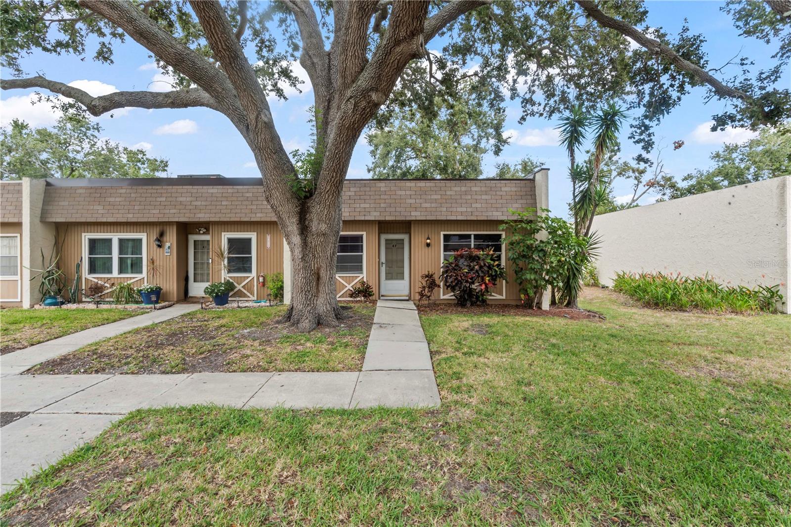 Welcome to this inviting first-floor condo offering 965 square feet of comfortable living space in the heart of Seminole. This well-maintained residence features a practical split-bedroom layout, providing privacy and convenience for residents and guests alike. The open living and dining area offers plenty of room to relax or entertain, with sliding doors leading to a private patio that’s perfect for enjoying Florida’s warm weather. The primary bedroom includes an en-suite bathroom and ample closet space, while the second bedroom and full bath gives flexibility for family, guests, or a home office. Located in a friendly community with great amenities, residents can enjoy a sparkling swimming pool, tennis court, and a welcoming clubhouse for social gatherings. Conveniently situated near shopping, dining, beaches, and parks, this condo provides an excellent opportunity to enjoy the best of Seminole living. Whether you’re looking for a year-round home or a seasonal retreat, this spacious condo combines comfort, convenience, and a fantastic location. Condo is on a land lease.