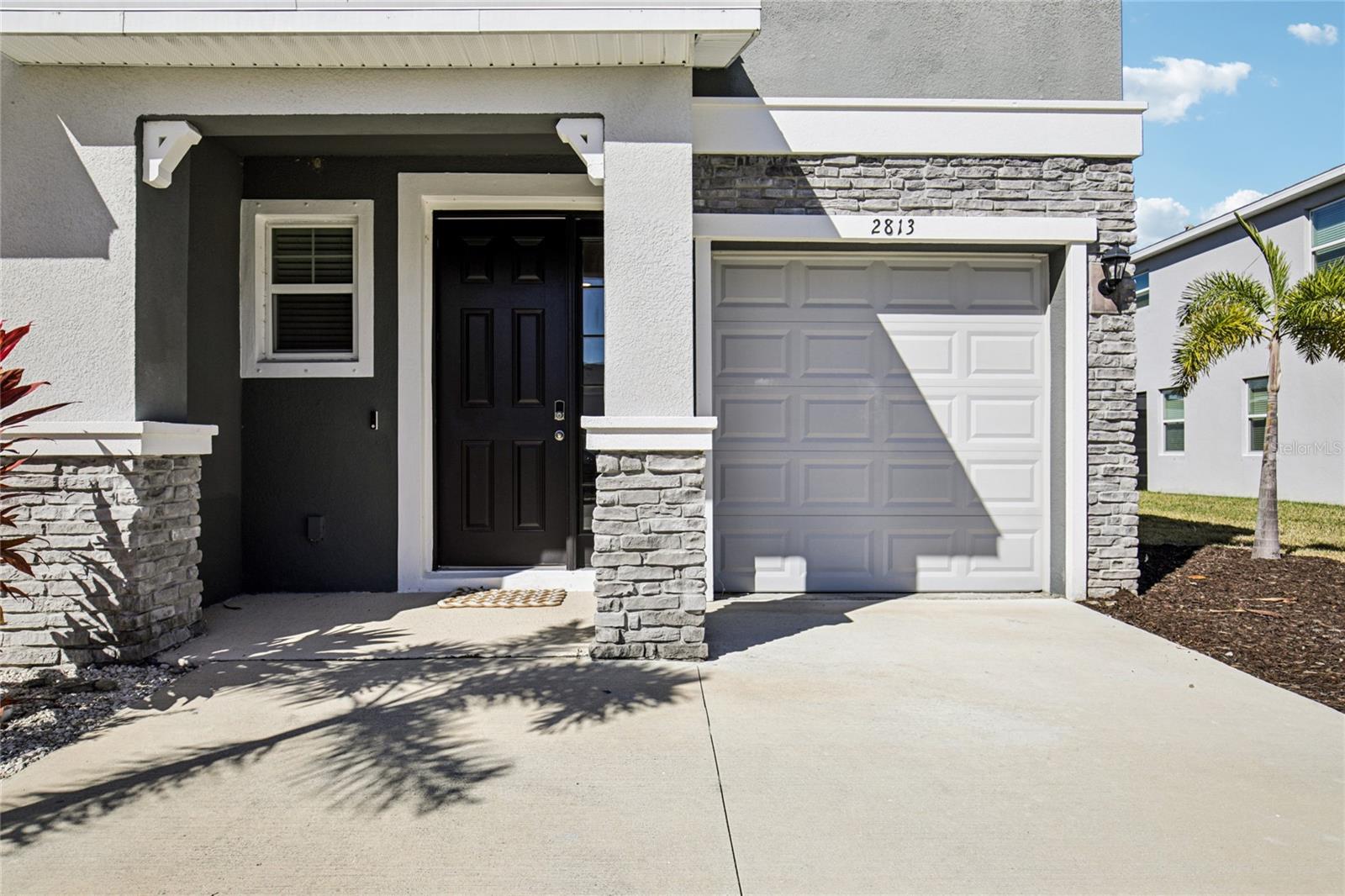 Make this beautiful townhome your families paradise.  Big and roomy, this end-unit townhome looks and feels brand new.  Offering a bright, open floor plan with tasteful improvements and beautiful light and bright Florida Light and Bright Cabinetry! Take peace of mind and receive insurance discounts with an insulated storm rated front door and heavy gauge metal shutters! Inside, the stylish kitchen features granite countertops, Stainless Steel appliances, subway tile backsplash, a walk-in pantry, and more! Sparkling large ceramic tile fill the first floor and upper floor bathroom spaces. Energy efficient insulation blown in to the newer Roof, newer Hot Water Heater and newer HVAC system have all been well maintained and keep your home comfortable. Low E, energy efficient double pane, tinted windows keep your home cool in the summer and warm in the winter. Upstairs, spacious separate bedrooms and a flexible loft provide room to relax, work and unwind. Enjoy added privacy with poured concrete block construction and a concrete party wall. You'll appreciate everyday conveniences including a smart-home package, washer/dryer inside, one-car garage and two exterior parking spaces. The screen enclosed lanai open to the green belt is a wonderful private outdoor space to cookout, relax in the fresh air and enjoy Florida, . Residents enjoy a gorgeous resort-style pool, fitness center, dog park, playground and more. Minutes from Waterside Place, Lakewood Ranch, UTC, Downtown Sarasota, and the world renowned beaches! No CDD fees and low HOA dues make this gorgeous home a standout value! Call today to schedule a private tour and see for yourself! Restrictions for lender contribution apply.