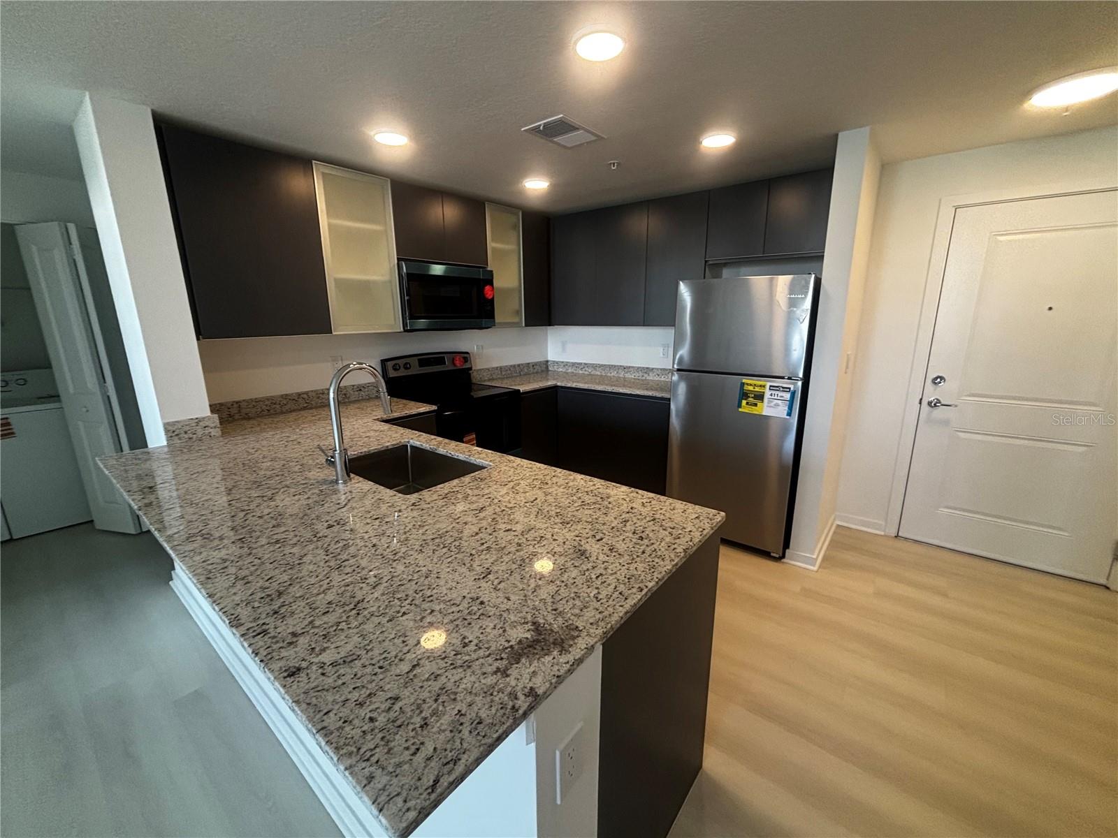 Steps from The Mall at Millenia and Universal park. Be the first to live in one of Orlando's newest communities. This 2-Bedroom + DEN / 2-Bathroom residence offers an open-concept layout, abundant natural light, and modern finishes throughout. The DEN is the standout feature — a spacious and versatile area ideal for a home office, media room, guest space, or easily adaptable as a third bedroom. Enjoy the functionality of a 3-bedroom layout while paying the rent of a 2-bedroom. Conveniently located just minutes from The Mall at Millenia, Universal Studios, International Drive, premier dining, shopping, and entertainment. The modern kitchen features brand-new stainless-steel appliances and contemporary cabinetry designed for both style and functionality. New closet cabinets and new modern lamps. Community amenities including pool, fitness center, park, and recreational areas.
