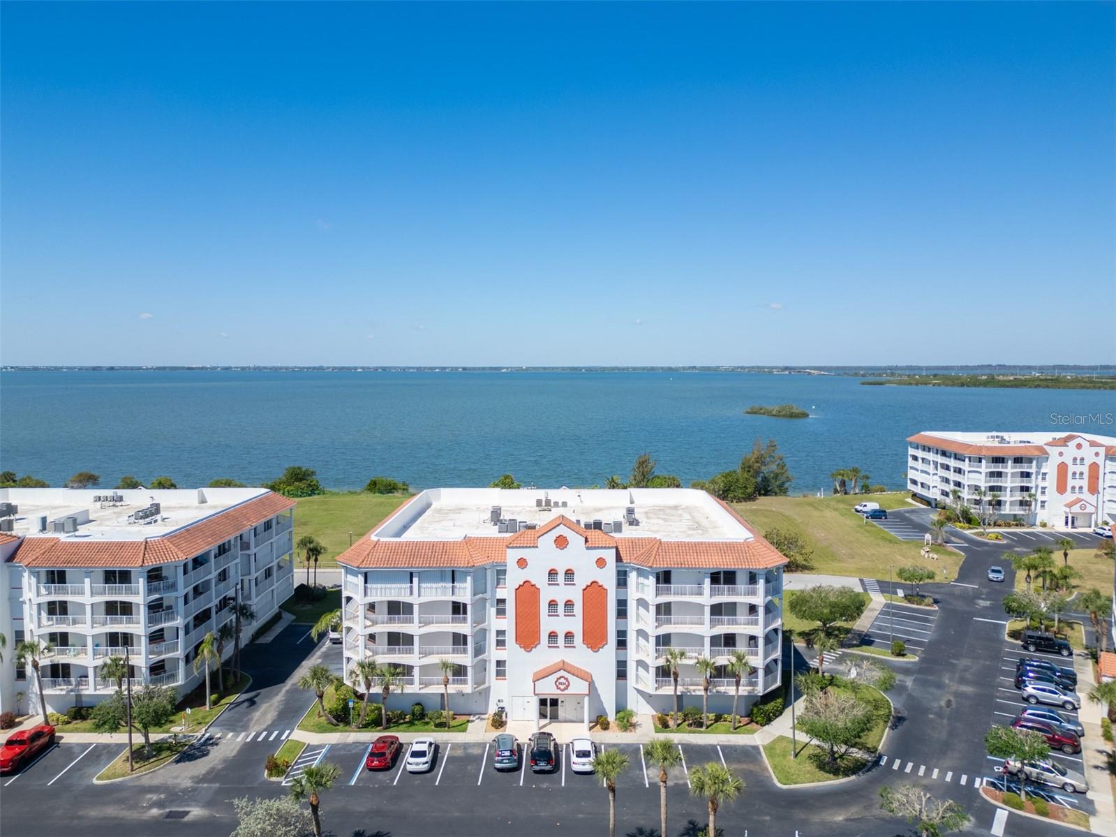 Beachside luxury meets effortless Space Coast living in this beautifully remodeled Puerto Del Rio condominium. Featuring 3 bedrooms and 2 full baths, the home is designed for comfort and style. The newly renovated kitchen boasts quartz countertops, modern cabinetry, and black stainless steel appliances. New tile and engineered hardwood flooring flow seamlessly throughout the open layout, complemented by impact sliders that fill the interior with natural light. The expansive wraparound balcony offers the perfect spot for morning coffee, evening sunsets, or viewing rocket launches. The spacious primary suite includes dual walk-in closets, a garden tub, and a walk-in shower. Under-building parking and private storage add convenience, making this residence a true blend of coastal elegance and everyday comfort. Minutes from beaches, Port Canaveral, theme parks, and Orlando International Airport, this home offers the ultimate in Space Coast lifestyle.

Puerto Del Rio offers resort-style amenities, including a riverside heated pool and spa, clubhouse, fitness center, sauna, walking paths, secure lobby entry, and under-building parking with private storage. Water, cable, and internet are included, and the community's lush grounds provide ideal vantage points for rocket launches and breathtaking sunsets. Schedule your showing today!
