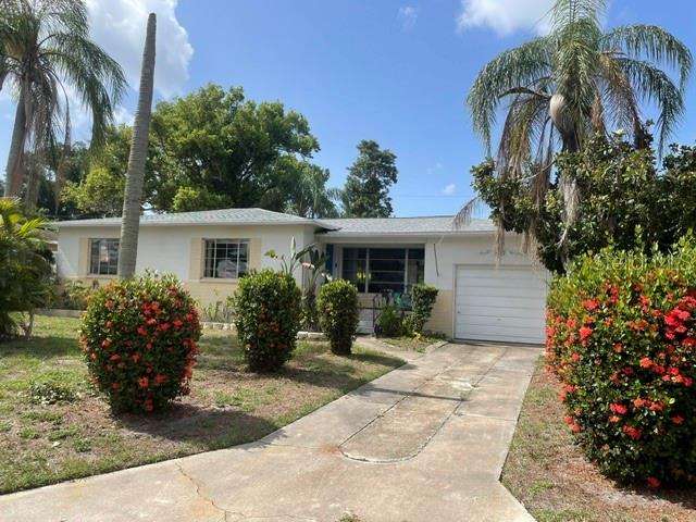 What a Great Layout in this cute Bungalow.  Walk in the front door and you are in a spacious living room.  To the right is an eat-in kitchen and family room or you can also use family room as a formal dining area. There is a sliding glass door that leads out to a nice screened in porch that overlooks a large backyard.  Off the side of family room is a door that leads to the garage.  On the other side of house are 2 spacious bedrooms and a cute bathroom.  This home is completely livable but needs updating to get the full value which is why it's priced accordingly.  Roof 2003, hot water heater 2021, AC 2003.