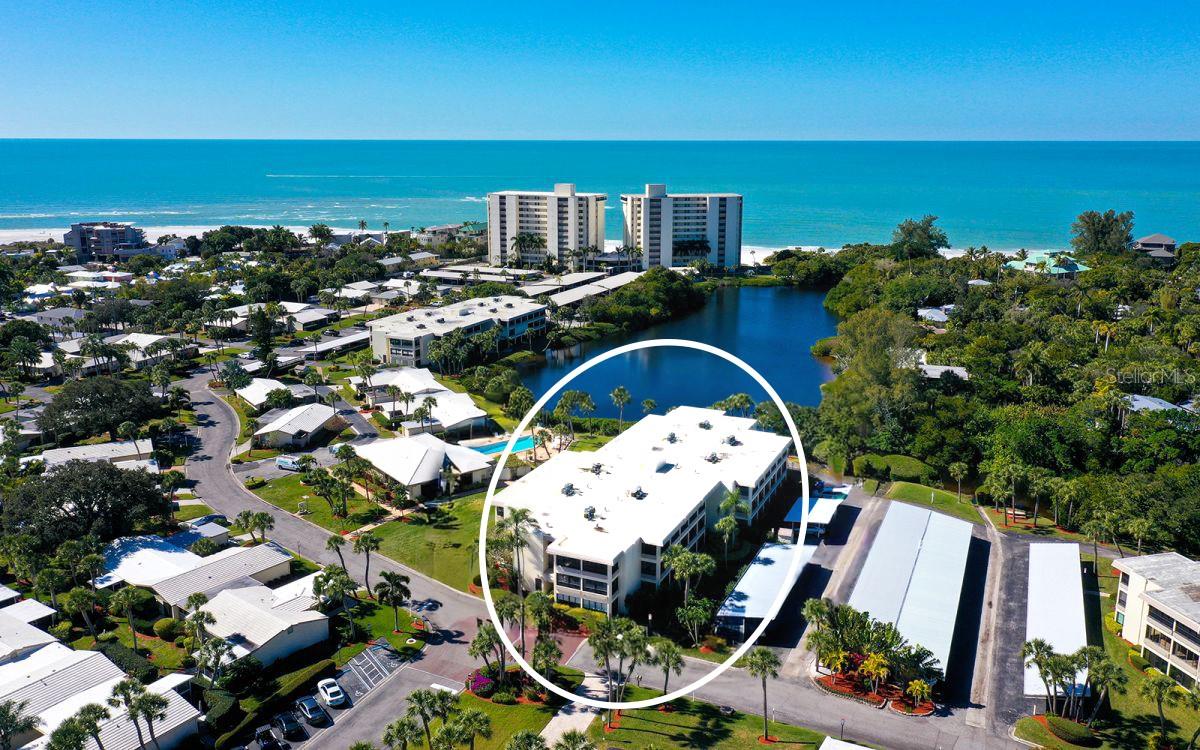 Welcome to effortless coastal living in this beautifully UPDATED second floor midrise residence in the premier GULF FRONT property of Whispering Sands! Designed with an OPEN CONCEPT floor plan, this light-filled condo showcases a bright, sophisticated 2023/2024 REMODELED kitchen featuring quartz countertops, stainless Samsung appliances, an impressive 8' breakfast bar with seating for 3, soft close cabinetry, and recessed lighting—all complemented by an elegant uplit tray ceiling. A true highlight is the expansive 29' x 8' lanai stretching the full length of the residence—offering an inviting extension of the living space ideal for relaxing, dining, or working from home, complete with hurricane impact sliders for total peace of mind. Both bathrooms have been tastefully updated with granite countertops and tiled, glass-enclosed walk-in showers, while ceiling fans and crown molding add comfort and sophistication throughout the unit. Beyond the residence, Whispering Sands offers true resort-style living in a premier Gulf front setting. Spend your days lounging on your private beach, taking a refreshing swim in one of two heated pools, an invigorating workout in the gym, or enjoying the vibrant social atmosphere of the clubhouse just steps from your door. Whether it’s a peaceful morning walk along the shoreline or a sunset gathering with neighbors, every day feels like a vacation. Perfectly positioned just steps from the clubhouse—currently undergoing complete remodeling in 2026—and pool, and a short stroll along the sidewalk to your 800' of your own private beach, this residence embodies the very best of resort style living. Ideally located just around the corner from the boutiques and restaurants of Siesta Key Village, you'll enjoy the perfect balance of relaxed beachfront living and easy access to dining, entertainment and island charm.  Move right in and start enjoying the easy island lifestyle you’ve been dreaming of!