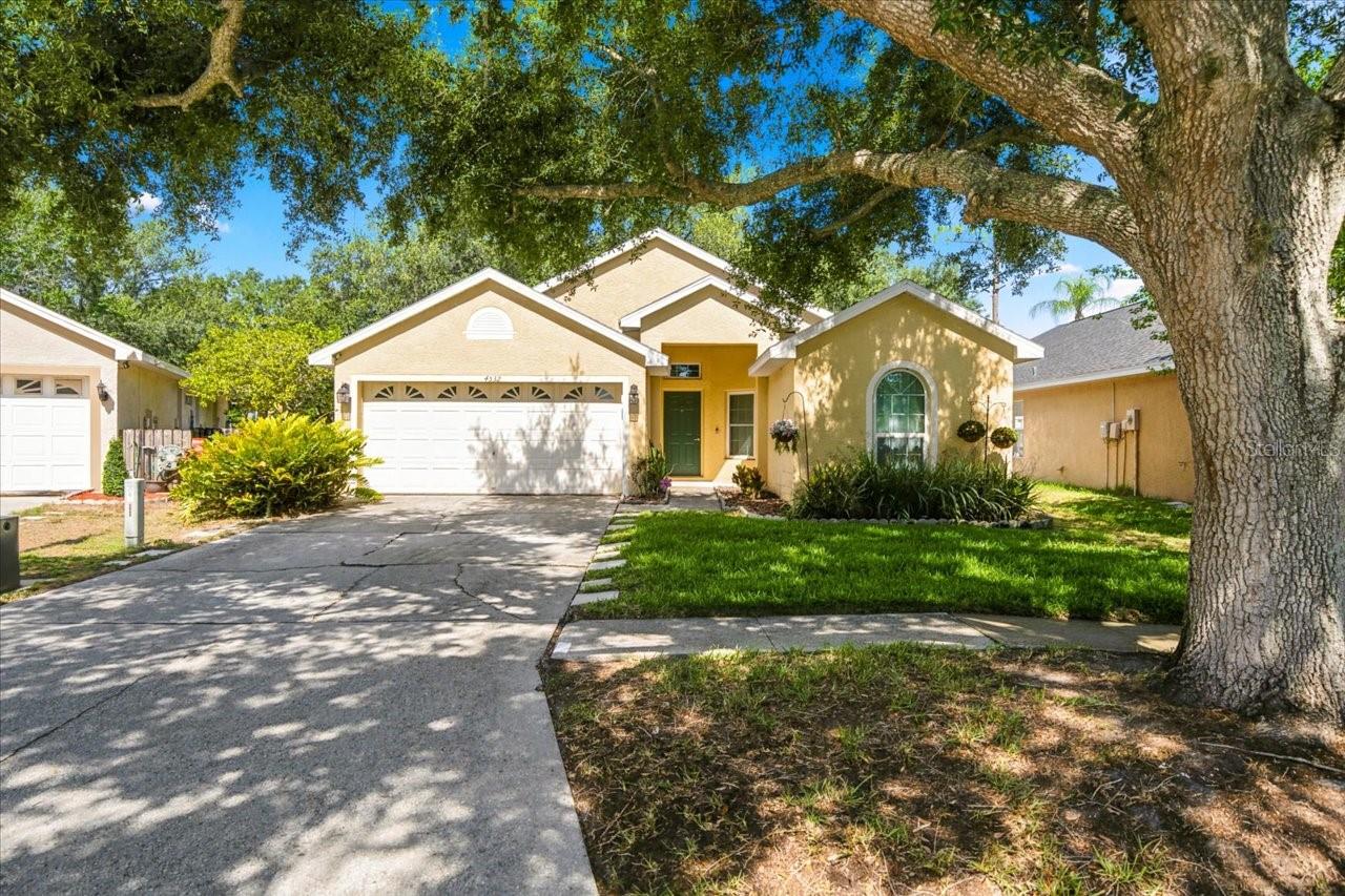 Welcome home to Villarosa-this beautifully maintained 3-bedroom, 2-bath residence offering over 1,600 square feet of comfortable living space. Designed with a desirable split-bedroom floor plan, this home features an open-concept layout that seamlessly connects the kitchen and living areas, creating the perfect space for everyday living and entertaining. The spacious primary suite is a true retreat, featuring a luxurious en-suite bath with dual walk-in closets, a relaxing garden tub, and a separate walk-in shower. The kitchen is the heart of the home, complete with a center island and breakfast bar, separate dinette area, and formal dining room for larger gatherings. Step outside and enjoy the large, screened patio, providing an ideal space for morning coffee or evening relaxation. Significant updates include hurricane-impact Low-E windows, a one-year-old Wi-Fi-enabled water heater, Nest smart thermostat with remote access, ring doorbell and a roof that is only seven years old.  The home also comes with galvanized hurricane shutters.  Great location in Steinbrenner School district!  Combining thoughtful upgrades, smart-home features, and a functional floor plan, this home is ready for its next owner to move in and enjoy.