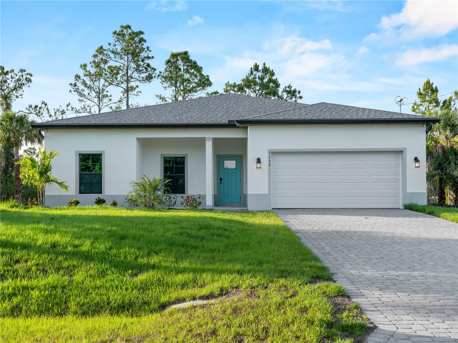 Tile throughout. Quartz countertops. Impact windows. Paver driveway. Whole-house generator plug. Fully upgraded new construction in North Port.

Flood insurance is not required for this property.

This home sits close to I-75. If you commute or want quick highway access, that's a real advantage. If highway proximity is not for you, this one is not the right fit.

The layout is a 4-bedroom, 2-bath split floor plan with 1,710 square feet of living space. The open kitchen and living area work well for everyday living and entertaining. The primary suite is separated from the three secondary bedrooms, giving you flexibility for guests, a home office, or whatever you need the space to be.

No carpet anywhere. No vinyl. Tile throughout every room.

Impact-resistant windows are already in. The paver driveway is already in. The whole-house generator plug is already in. The builder did not cut corners on this one.

Buyers may be eligible for up to $5,000 in flex cash that can be applied toward closing costs or a rate buy-down.
Backed by a 2-10 Builder's Warranty.

Some photos are of the same floor plan and may not reflect current fixtures or colors in this home.