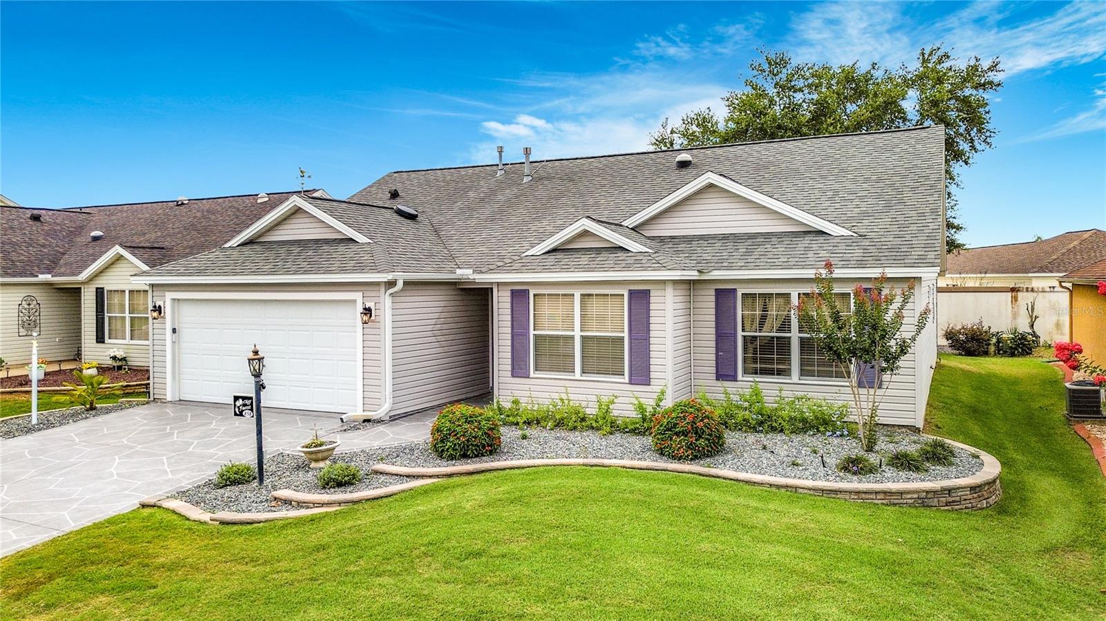 Location, Location...Welcome home to this lovely Whispering Pines residence in The Village of SABAL CHASE, walking to the pool and 5 min golf cart drive to lake Sumter. Open the glass front door and step into a spacious, open floorplan with tile flooring flowing throughout the main living space. The kitchen features a classic layout with granite countertops, abundant counter space, and a cozy breakfast nook, while the formal dining area is large enough to accommodate your full dining set. Your eyes will be drawn to the enclosed lanai — a peaceful retreat with enclosed lanai under A/C, perfect for enjoying your morning coffee or entertaining friends. The primary suite offers a large walk-in closet. This move-in-ready home features no carpet, it has hardwoods throughout, a birdcage enclosure, a putting green in the backyard and a wall along the back of the property for added privacy. Bond: $5,742. Roof is 4 y old
