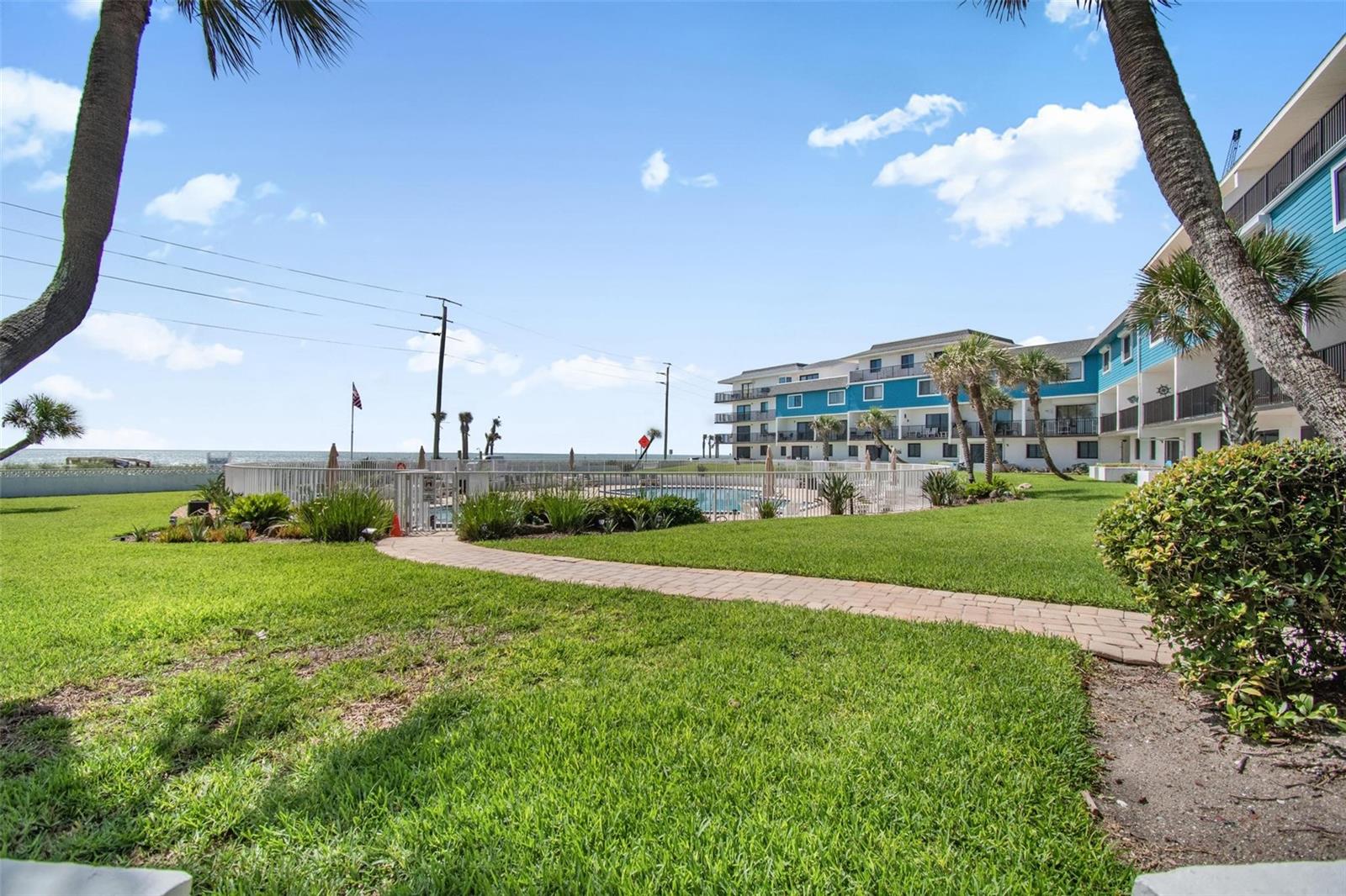 This versatile coastal two bedroom/2 bathrooms retreat offers endless opportunities as an investment rental, personal Beachside escape or combination of the two! Fully furnished and features a rare short-term rental license in Flagler Beach, this unit is ready to enjoy from day one. Ocean Beach Club One (OBC!) what is private dog – friendly beach access. Tennis/Pickleball, grills, and the largest pool in Flagler Beach. Recent update to the unit include a new HVAC.(2026), water heater*2026), dishwasher and stove (2024), fresh paint and ceiling fan. HOA fee  cable, Internet, Water, Pest Control, and the maintenance/maintenancing of all common areas and amenities. Ideally located near Gamble Rogers State Park with Daytona and St Augustine approximately 30 minutes away, this is your opportunity to own a personal piece of Paradise.