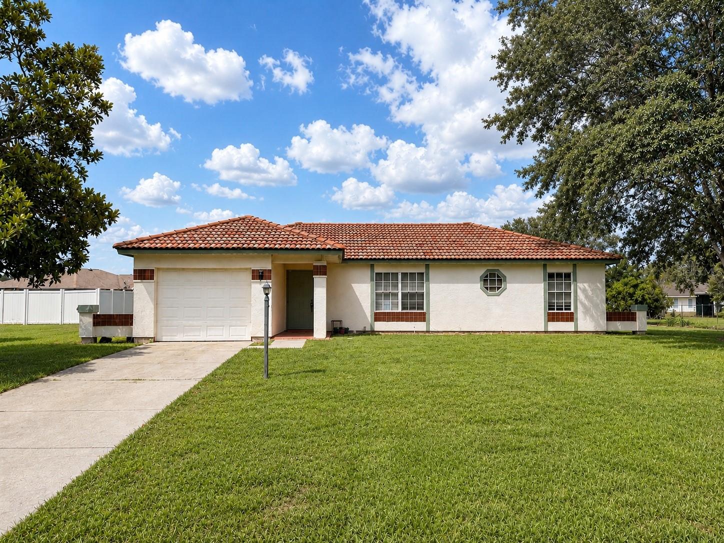 Available now! This well-maintained 3-bedroom, 2-bath home offers a convenient location in the Crystal Lakes neighborhood, located in Silver Springs Shores, near Ocala and Belleview, providing easy access to shopping, dining, medical facilities, and major roadways. The home features tile flooring throughout, a single-car garage, a very large screened back porch, and comfortable living spaces designed for everyday living. Schedule your showing today!