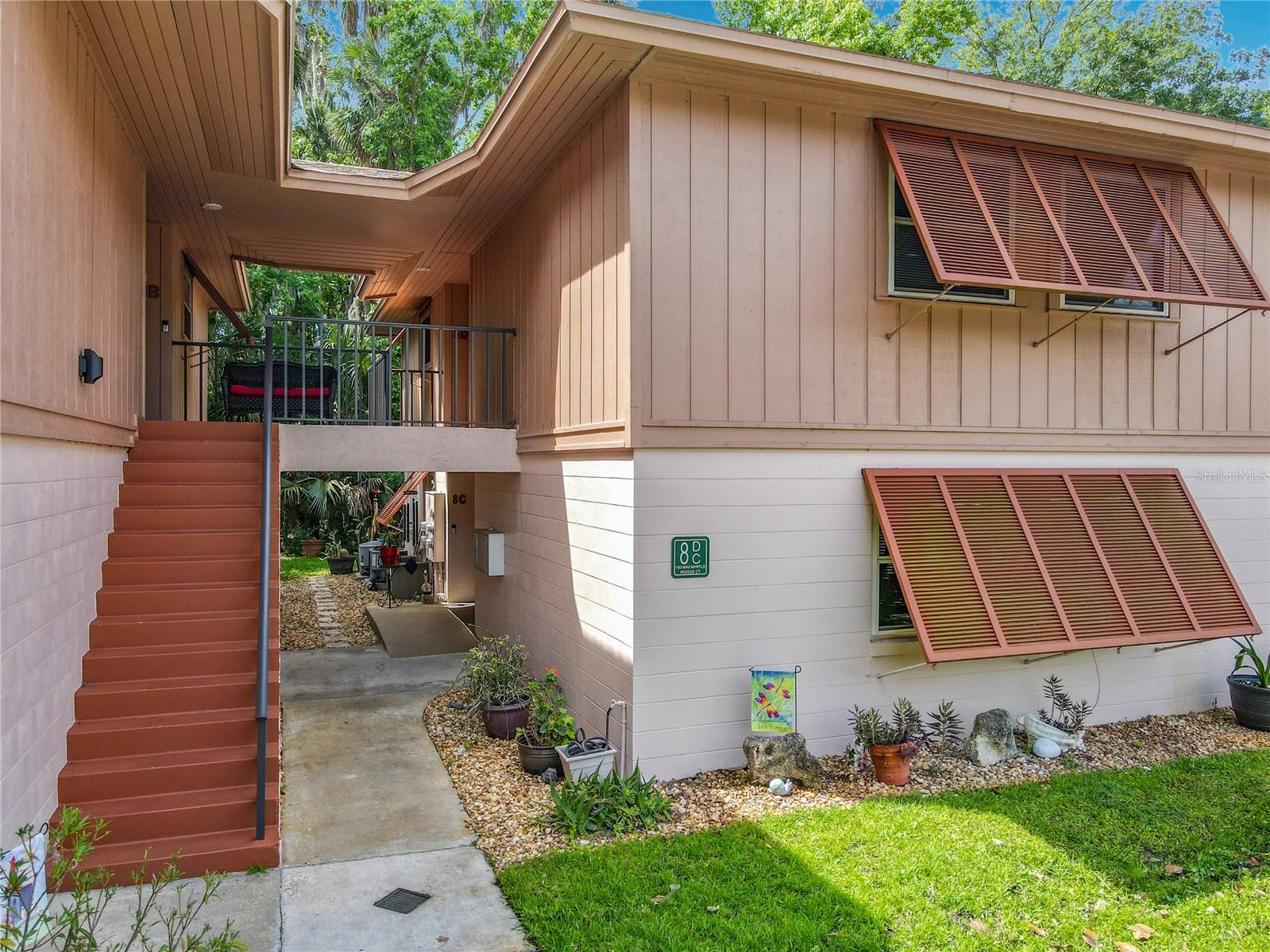 Some rooms have been virtually staged. LOW HOA!  Only $217/month! Immaculate ground-floor END unit offering peaceful wooded views and low-maintenance living. This beautifully updated home features new luxury vinyl flooring throughout, renovated bathrooms, and major upgrades including NEW WINDOWS and SLIDING GLASS DOORS. A front entry ramp provides added convenience and accessibility.
Enjoy the Florida lifestyle with nearby access to Lake Monroe and Green Springs Park, along with community amenities including a two pools, Recreation center with Corn hole and Shuffle Board, Pickle Ball/tennis courts, and Bacci Ball court. Immediately adjacent to the community is the East Central Regional Rail Trail, a scenic 52-mile paved trail perfect for walking, jogging, skating, and cycling. Conveniently located near Interstate 4 for easy commuting to Orlando, area beaches, and Orlando and Sanford International Airports. Schedule your private showing today.