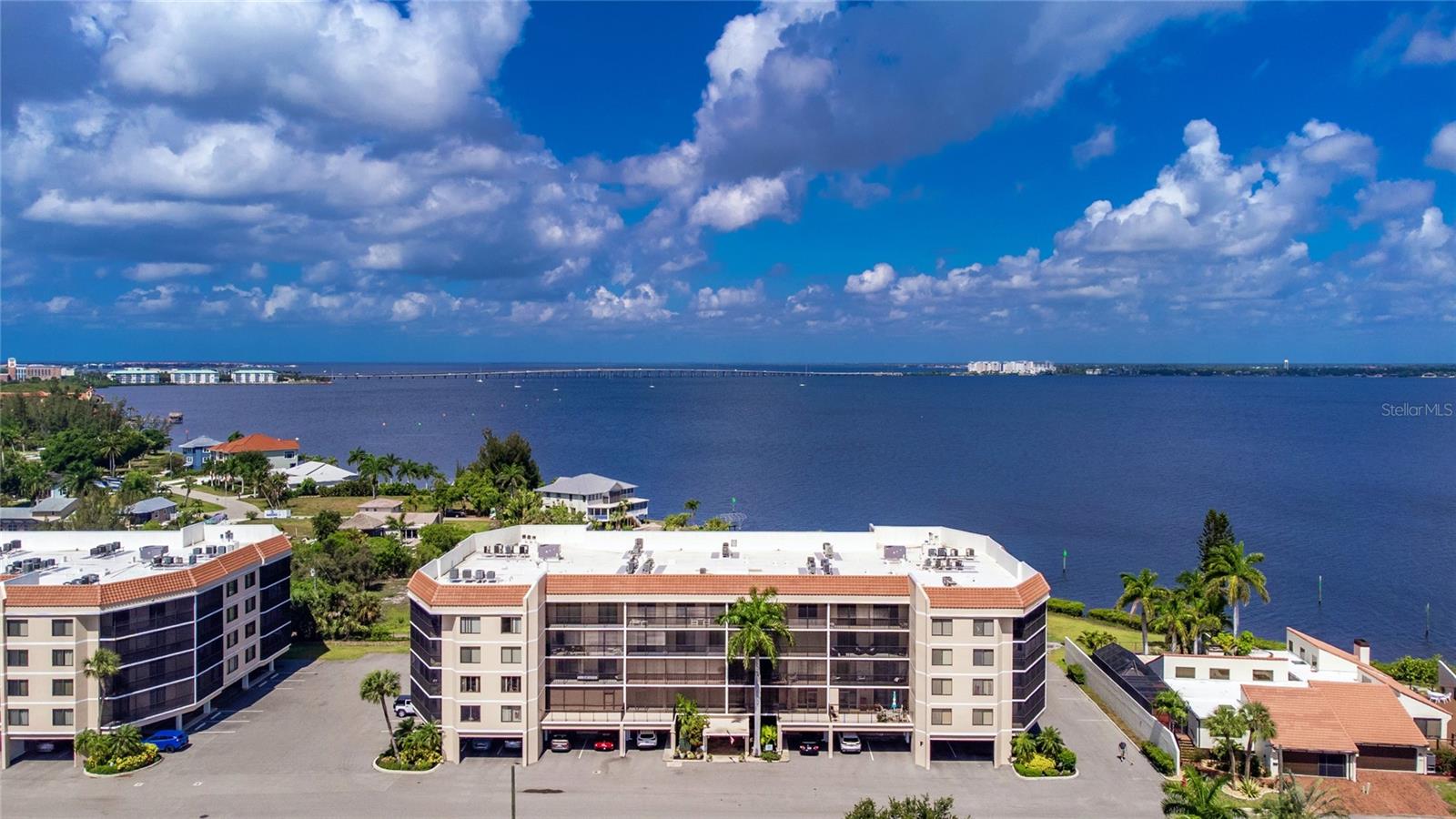 Discover Punta Gorda living at its finest in this beautifully furnished 1-bedroom, 1-bathroom condo located in the highly sought-after Emerald Pointe community. Offering breathtaking views of Charlotte Harbor, this exceptional condo combines comfort, style, and resort-style amenities in one remarkable package. Step inside to find an updated kitchen featuring elegant quartz countertops, crisp white cabinetry, a stainless-steel sink, modern lighting, tile flooring, and a spacious pantry with additional storage. The open-concept living area is filled with natural light and showcases stunning water views, tile flooring, a ceiling fan, and direct access to the screened lanai — the perfect place to relax and enjoy the serene surroundings. The spacious primary suite offers picturesque harbor views right from your bed and includes luxury vinyl plank flooring, a walk-in closet, abundant natural light, and a private ensuite bathroom. The updated bathroom features an updated vanity, modern mirrors, upgraded fixtures, modern lighting, and a tub/shower combination. Additional highlights include two exterior storage closets, a private covered parking space beneath the building, and extra under-building storage for added convenience. Emerald Pointe is a premier gated waterfront community offering an impressive array of resort-style amenities, including three swimming pools, a marina with 4,000 feet of assigned boat dockage, a two-story clubhouse, fitness center, tennis courts, pickleball courts, game room, organized activities, boat/RV parking, and 24-hour manned security. Condo fees provide outstanding value and peace of mind by covering cable TV, internet, water, sewer, trash service, exterior/ ground maintenance, building insurance, escrow reserves, and more! Ideally located just minutes from downtown Punta Gorda, Fishermen’s Village, Punta Gorda Airport, shopping, dining, and golf courses, this stunning condo offers the perfect opportunity to enjoy the Florida waterfront lifestyle. Schedule your private showing today and experience the captivating views and exceptional upgrades that make this property truly unforgettable.