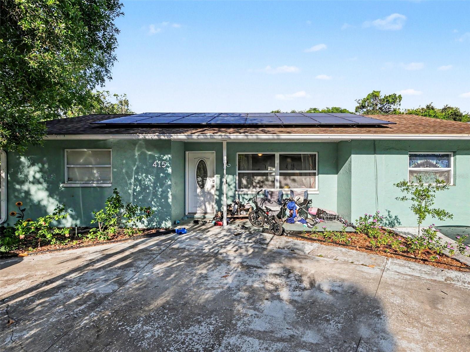 Charming 3-bedroom, 2-bath pool home on a spacious corner lot in Clearwater’s Oakmount community. This well-maintained residence features granite countertops, tile backsplash, wood cabinetry, black appliances, and a versatile converted garage offering additional living space. Enjoy the screened pool enclosure, fully fenced yard, wraparound driveway, owned solar panels (2022), and mature landscaping. Conveniently located near shopping, dining, parks, and major roadways.