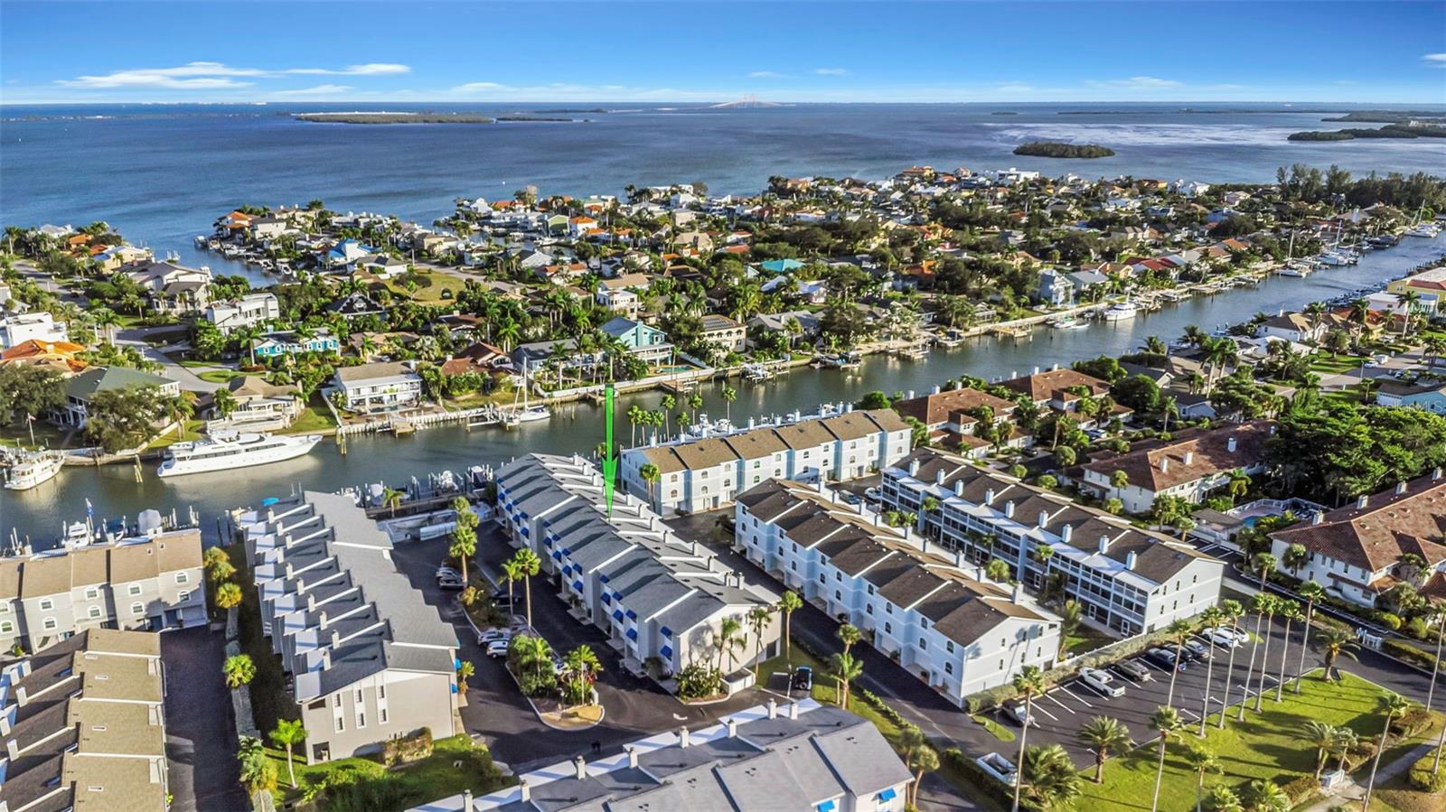 Your Island Paradise Awaits!! Coastal Living on the Water!! Welcome to this beautiful townhome where coastal breezes and effortless living come together in perfect harmony. Located on a peaceful island just minutes from everything, nestled among million-dollar homes and yachts, this stunning residence delivers the lifestyle so many dream about and now it can be yours!! 

Open-concept layout invites both relaxation and entertaining. The spacious living room features a cozy fireplace and sliding glass doors leading to your private balcony. A generous dining area flows seamlessly into the kitchen, complete with a breakfast bar, center island and plenty of cabinet space. A convenient half bath on this level adds ideal functionality for guests.

Upstairs, the third floor hosts two comfortable bedrooms, including the primary bedroom with its own private balcony, a peaceful retreat to unwind each evening. The spacious primary bathroom features a relaxing bathtub where you can slip away with your favorite book and enjoy a quiet moment to yourself. The guest bedroom offers convenience and privacy with its own bathroom featuring a walk-in shower.
The laundry is thoughtfully located on the same floor as the bedrooms, making everyday living effortless and efficient.

Downstairs, the spacious garage offers room for your vehicle, storage, and toys, while the BONUS room, not included in the square footage, provides incredible flexibility. Use it as an exercise room, workshop, hobby space, or extra storage. A door leads to a covered patio, perfect for enjoying the shade after a day on the water.

The community has been thoughtfully updated with newer roofs and solar attic fans, helping reduce energy costs and protect your investment. Spend your days lounging at the waterfront pool, with exciting enhancements to the entire pool area coming soon to elevate your coastal experience even more.

All of this is set in an unbeatable location!! Walk to island restaurants, bike to nearby parks, or take a short 5-minute drive to the award-winning Fort De Soto beaches and dog park. You’re also just 10 minutes from vibrant downtown St. Pete, 30 minutes to Tampa International and 45 minutes to Sarasota.

This is more than a home, it’s a coastal lifestyle, fully ready for you to step in and enjoy.
Imagine the life you could live here.  See… Fall in Love… Make it your own!!!