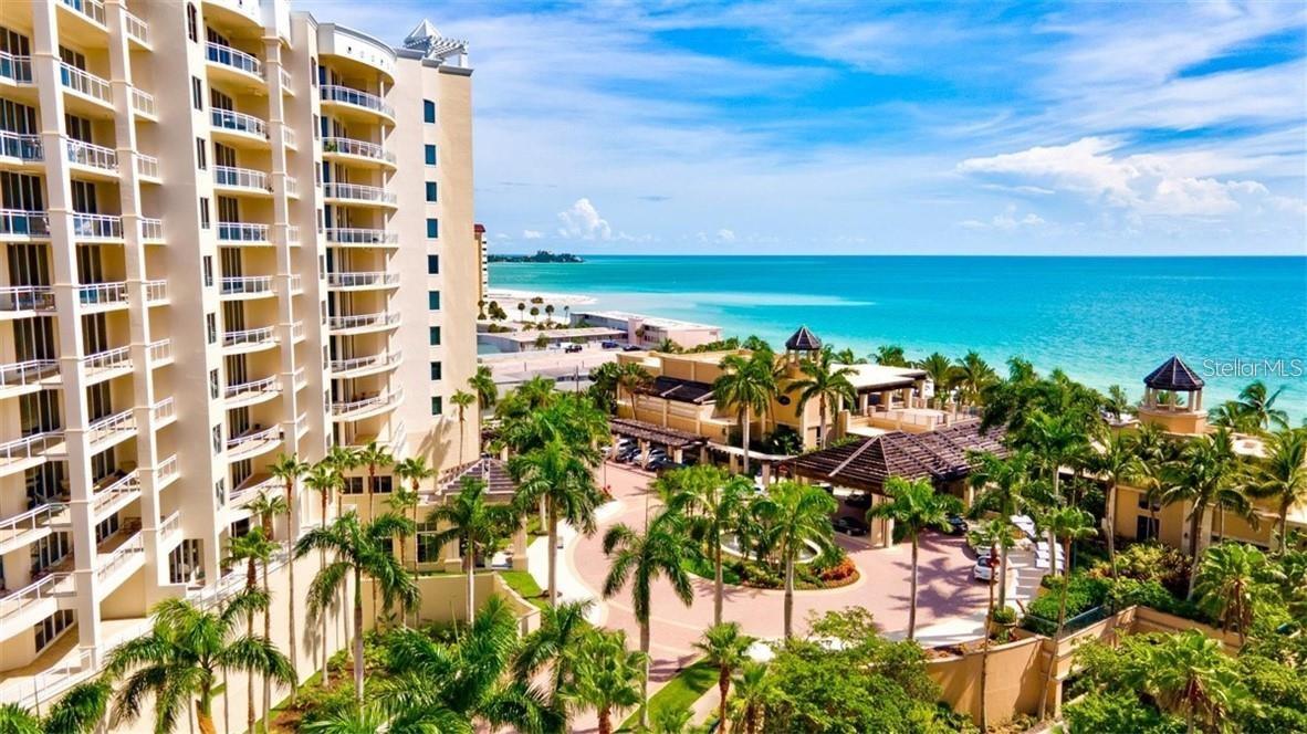 One or more photo(s) has been virtually staged. Live where others wish to vacation... Steps from the quartz-white sandy shores of Lido Key sits The Beach Residences Sarasota. This luxury Gulf-front and sun-kissed haven is where opulence is complimented by exclusivity. Managed by the famed Ritz-Carlton, this contemporary high-rise is where legendary service meets an incomparable array of upscale amenities and resort-style leisure. 
Nestled on the coveted Sarasota Bay barrier island of Lido Key, this expansive residence features a thoughtful 2-bedroom 2.5-bath layout that blends an open-concept plan with a split-bedroom design for optimal privacy. A welcoming foyer frames the turquoise Gulf waters and lush emerald green tropical landscaping as you step inside.  Perched on the 3rd floor, soaring 10-foot ceilings and floor-to-ceiling walls of glass flood the residence with natural light. The great room and dining area flow seamlessly to a private terrace that spans the full width of the residence. With views from a generous 400+ square-foot outdoor space, you can enjoy alfresco dining and cool Gulf breezes.
 
This residence is ideal for entertaining, with a layout tailored for gatherings or intimate evenings with friends and family. The chef’s kitchen overlooks an inviting living area and features granite countertops, a substantial breakfast bar, solid-wood cabinetry, gas cooktop, built-in appliances, and a Sub-Zero refrigerator.  Both bedrooms open directly to an expansive terrace for stunning westerly views and award-winning daily sunsets. The gracious primary suite serves as a serene retreat, featuring a spa-inspired bath and jetted tub, large walk-in shower, dual vanities, and a spacious walk-in closet. Additional conveniences include a laundry room with sink, deeded garage parking space, separate air-conditioned storage room, and 2 guest suites available for visitors. The Beach Residences are renowned for exceptional service and offer premier private-event spaces, including a social room with bar, boardroom, billiards or ping-pong room. Enjoy self-care in the private fitness center or indulge in fresh popcorn in the theatre or cappuccino at the coffee bar. Treat yourself with the massage room, yoga room, sauna, and beautiful outdoor pool and spa. Play with your furry friends in a private dog-run in this pet-friendly building with no weight limit! Grill a fresh catch near the fire pit where massive grilling stations complement the resort-style ambiance.
 
Residents enjoy: a 24-hour manned entry gate house, full-time concierge, 24-hour front desk security, onsite Ritz-Carlton Manager, a shuttle bus to St. Armands Circle or to the Ritz-Carlton Hotel in the city. Also, minutes away lie Sarasota’s pillow-soft beaches, while St. Armands Circle offers upscale dining, shopping, and entertainment. The downtown arts and cultural scene is within easy reach, providing countless recreational options.  As the sole single-level residence of its configuration currently available in The Beach Residences, this true 2-bedroom unit with 2 full baths plus a powder room represents a rare and exceptional opportunity. Schedule a private tour to see how this grand lifestyle can become your reality. Membership is available to the Ritz-Carlton Members Club immediately upon closing.