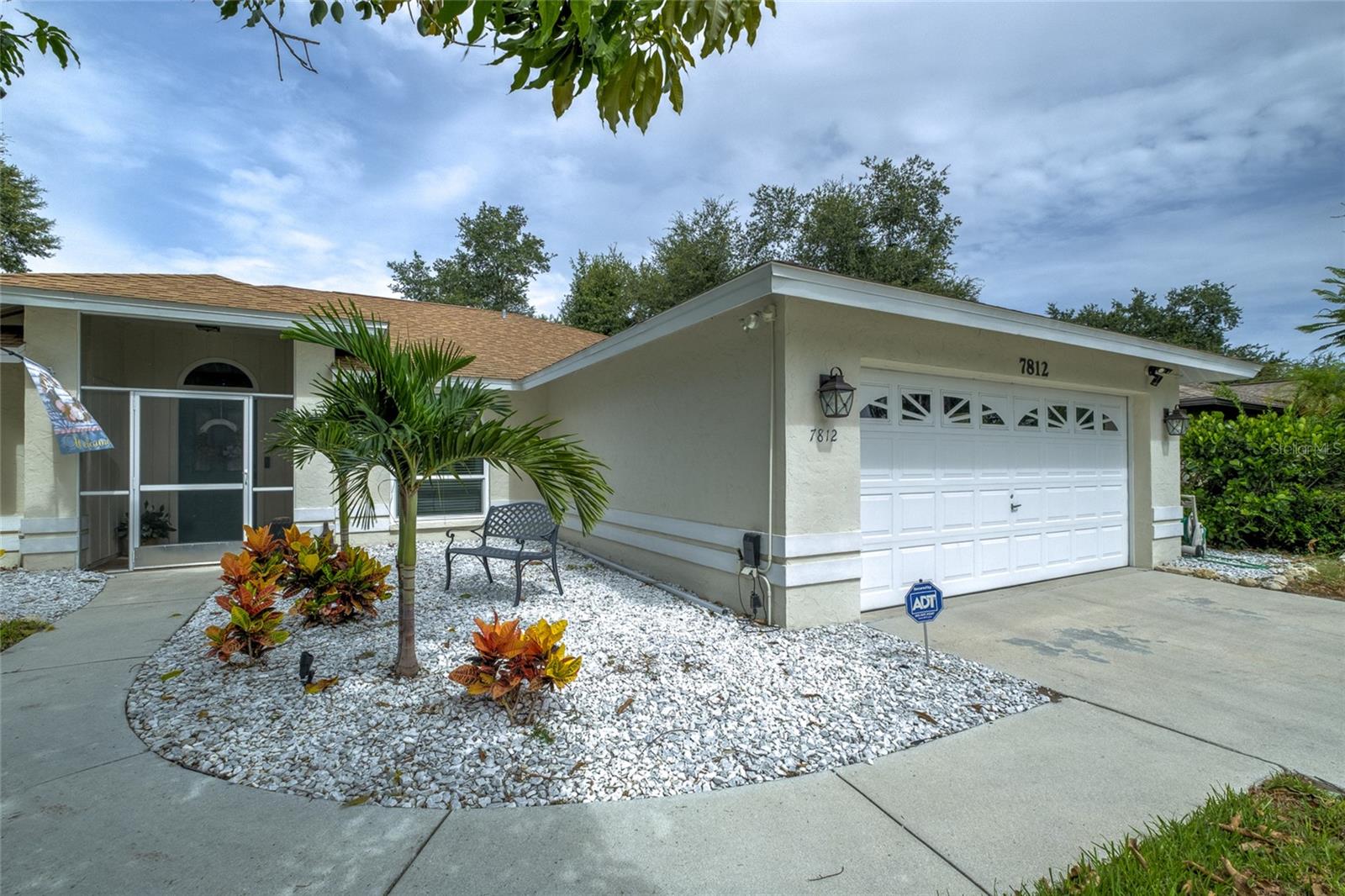 Welcome to this pristinely maintained 3-bedroom, 2-bath home with a versatile den/office in the desirable Copperfield community. Located in the Sarasota area but within Manatee County, you'll enjoy the convenience of a Sarasota address with the added benefit of lower Manatee County property taxes.
From the moment you arrive, you'll appreciate the inviting foyer featuring an elegant custom art niche, beautiful windowed front doors, soaring vaulted ceilings, and a French door leading to the private office—perfect for working from home or creating a quiet retreat. Natural light pours into the home through two oversized skylights, creating a bright and airy atmosphere throughout. Every window has been replaced with premium storm-rated windows by Armored Dade Windows, and the garage door has been storm reinforced, representing more than $28,000 in valuable storm-protection upgrades that provide peace of mind, energy efficiency, and lasting value.
The beautifully remodeled kitchen (2022) is both timeless and inviting, featuring on-trend two-tone cabinetry, natural-colored countertops, a designer backsplash, and crisp white appliances that perfectly complement the home's warm, earthy palette. An adjoining dining area offers the ideal setting for casual meals and effortless entertaining.
The spacious primary suite is a relaxing retreat with grand walk-in closet and a spa-inspired ensuite bath featuring dual vanities, a large soaking tub, and a glass-enclosed step-in shower. The guest bathroom offers a fresh coastal feel with a striking blue vanity that adds a cheerful pop of color.
Luxury vinyl plank flooring flows throughout the living areas and office, while the spacious screened lanai, guest bedrooms and bathrooms feature attractive tile flooring. Ceiling fans throughout the main living areas and lanai provide year-round comfort.
Step outside to enjoy the large, fully fenced backyard designed for easy maintenance. A brick paver patio creates the perfect setting for grilling, relaxing, or entertaining.
Additional features include an indoor, air-conditioned laundry room with a utility sink and built-in cabinetry, plus a spacious two-car garage with extra room for shelving and convenient pull-down attic access.

Copperfield is a well-established community with low HOA fees and an exceptional location just minutes from University Town Center, Lakewood Ranch, downtown Sarasota, Sarasota-Bradenton International Airport, championship golf courses, top-rated dining and shopping, and the world-famous Gulf beaches. This meticulously cared-for home combines quality updates, thoughtful improvements, and an unbeatable location to create an exceptional Florida lifestyle opportunity.