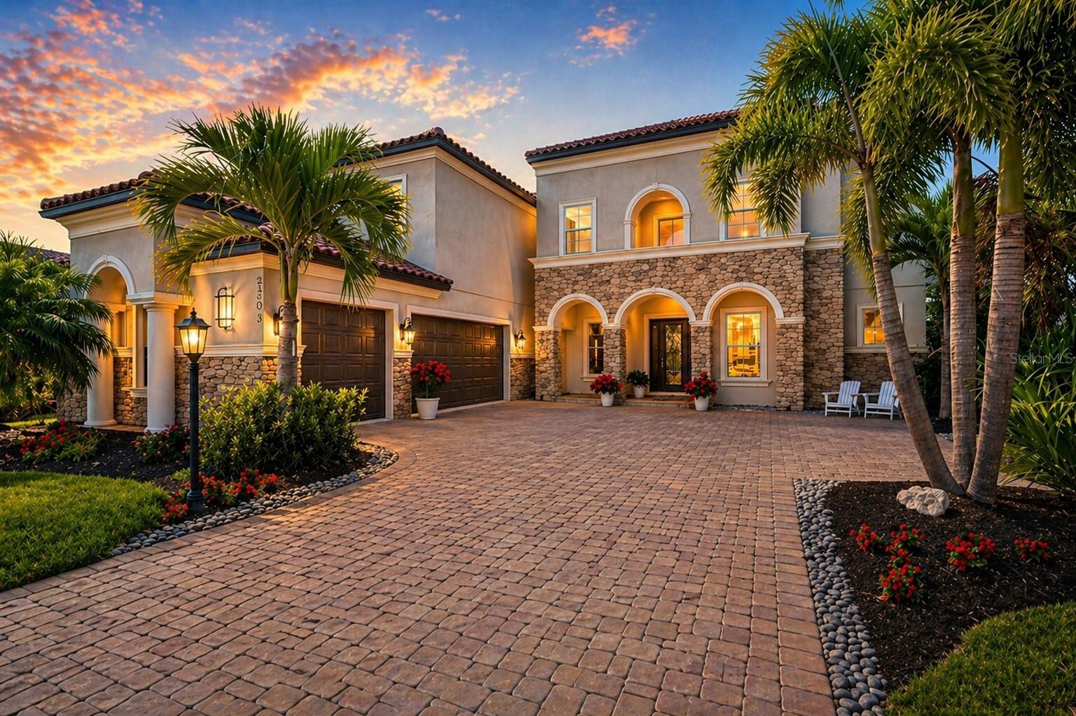 Opportunities like this are rare within the exclusive Legacy Estates at Esplanade on Palmer Ranch. This exceptional two-story Gulf Coast residence offers 5 bedrooms, 4 full baths, 2 half baths, and 5,171 square feet designed for luxury living, multigenerational flexibility, executive work-from-home, and elevated entertaining. Perfectly positioned on a private corner homesite with preserve views and direct access to the Legacy Trail, the home is just a bike ride from Gulf Coast waters and nationally acclaimed Pine View School, currently ranked #12 in the nation.

A dramatic gallery-style entry immediately captures attention with a striking overhead walkway connecting the upper-level wings before opening into a breathtaking two-story living room with soaring 25-foot ceilings, abundant natural light, and seamless indoor-outdoor living. The expansive three-panel sliders open to a private lanai, resort-style pool, and serene preserve backdrop with no neighbors to the rear or west.

The main level features an executive office with French doors, formal dining room, guest suite, chef’s kitchen designed for entertaining, and an elegant owner’s retreat with spa-inspired bath. Upstairs, four generously sized bedrooms are thoughtfully split between two wings, each featuring private sink and vanity areas. A spacious recreational loft overlooks the grand living area and is complemented by a half bath and additional flex room ideal for a theater, study, fitness room, or secondary office.

Additional luxury features include hurricane impact windows throughout, Sonos whole-home audio, abundant storage, gated security, and a spacious 3-car garage.

Legacy Estates at Esplanade delivers a true resort lifestyle with the on-site Bahama Bar restaurant, resort pools and spa, fitness center with studio classes, 8 pickle ball courts, 2 tennis courts, 3 dog parks, scenic nature trails, and direct Legacy Trail access. Oscar Scherer State Park is just one mile away.

More than a home, this is a private luxury retreat offering the ultimate blend of elegance, recreation, wellness, and Gulf Coast living. Schedule your private showing today!