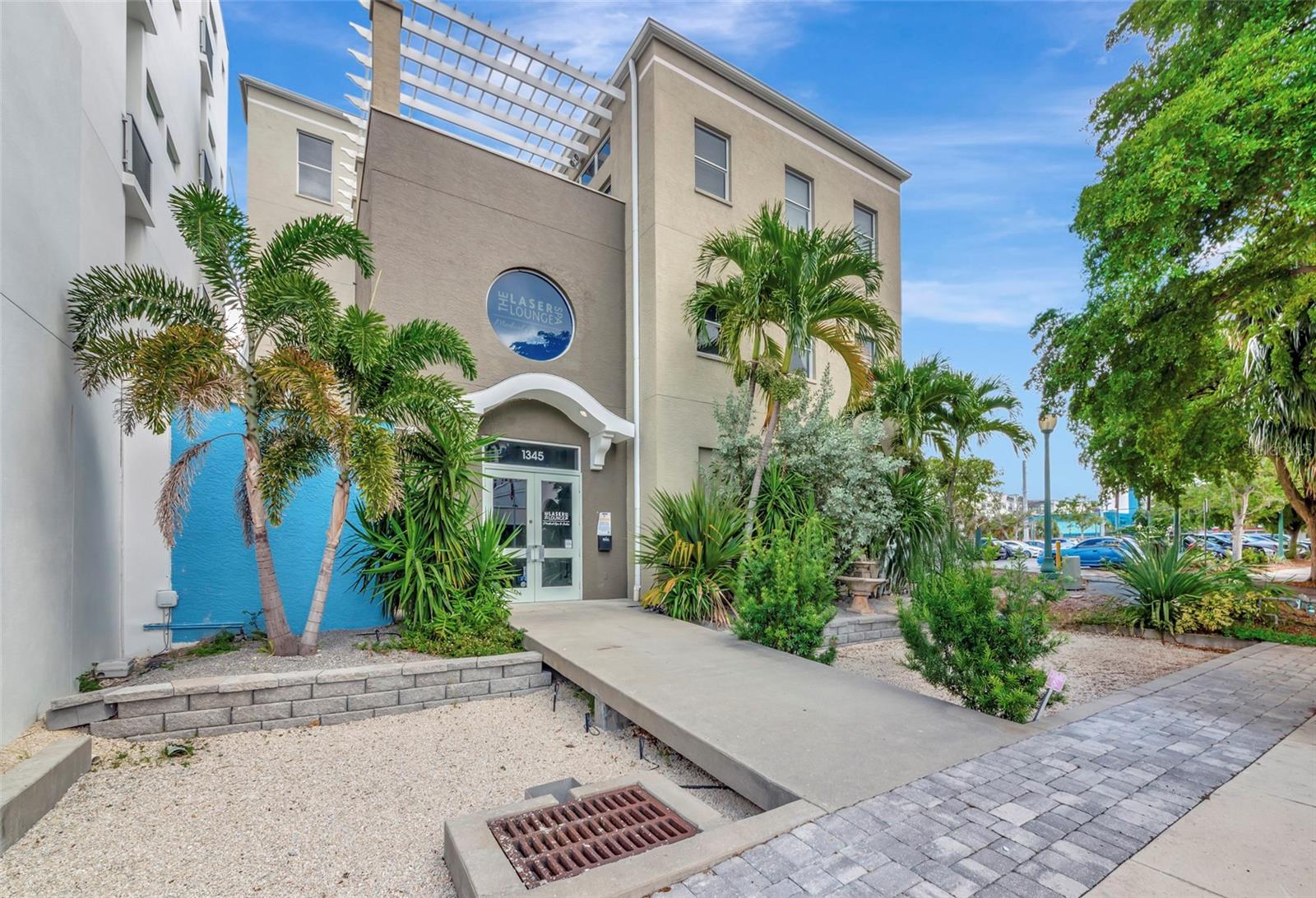 One or more photo(s) has been virtually staged. RARE OPPORTUNITY to purchase a mixed use building in the heart of Downtown Sarasota. This exceptional three-story mixed used building offers an unparalleled blend of luxury and convenience. With a prime location just steps from premier dining, shopping, and cultural attractions, this unique property invites you to embrace city living at its finest.
Constructed in 2000, the first floor welcomes visitors with a bright, coastal-inspired entrance,
featuring luxury vinyl plank flooring in a light oak finish. This level includes a spacious open area with an abundance of natural light pouring in. This floor was previously a salon sitting 12 stations, 6 wash stations, 4 drying stations, along
with 2 well-appointed bathrooms. The salon area has a state of the art mixing station, accented by high-end sleek dark tile.
Upstairs, accessible by both staircase and elevator, you'll find 7 generously sized treatment rooms with plumbing, 2 additional bathrooms, a dedicated breakroom, and an office. One of the standout features is a unique room with a stunning wall crafted from Himalayan salt bricks, adding a luxurious and tranquil touch. The second floor also includes a naturally well lit break room that accommodates both the first and second floor.
Ascend to the private penthouse on the 3rd Floor via the private access elevator and discover a breathtaking four-bedroom residence designed for modern sophistication. The expansive open floor plan is accentuated by soaring ceilings and abundant natural light streaming through floor-to-ceiling windows.
The chef’s kitchen is a masterpiece, featuring a grand island, wine fridge, built-in oven and microwave, and a six-burner gas cooktop with a dedicated grilling area. A separate full-length wet bar and coffee station, complete with two dishwashers and ample storage makes this private residence perfect entertaining. The seamless flow between the dining and living areas—anchored by a soothing fireplace—creates a warm and inviting atmosphere. Step outside onto the private balcony off the kitchen, where city views provide a picturesque backdrop for dining and entertaining A space perfectly designed for gardening or grilling out with friends. A striking spiral staircase leads to the third-floor bedroom with an en-suite half-bath and its own rooftop terrace for a tranquil retreat. This space is currently being used as a short term rental.
The building offers two assigned covered parking spaces.
There is a separate 4,880 SF lot in close proximity that can be purchased for additional parking or development located at 1374 Fruitville Rd, this is listed separately for $950,000 or you can purchase both.
This is a great opportunity for an owner occupier to run their dream business while living above.
The building is being sold as vacant however the med spa on the 2nd floor would consider staying on a long term lease.
Schedule a private showing today to learn more about this opportunity!