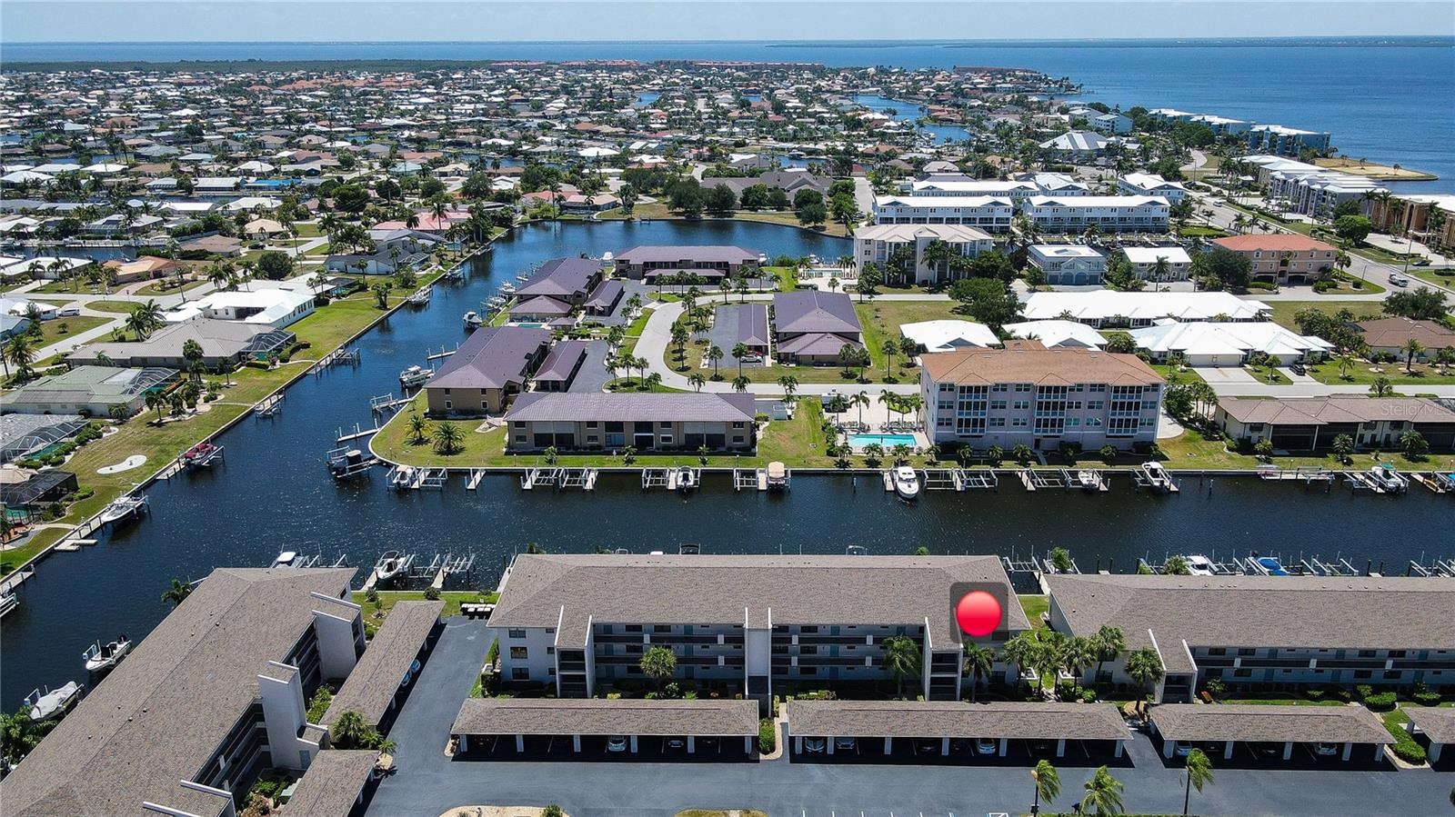 Wake up to tranquil canal views and embrace the Southwest Florida lifestyle in this beautifully furnished waterfront condo, perfectly situated just minutes from Fishermen's Village, downtown Punta Gorda, and some of the region's most stunning Gulf Coast beaches.

This beautifully renovated and maintained 2-bedroom, 2-bath condominium offers peaceful canal views and comes turnkey, making it truly move-in ready. Inside, you'll find porcelain tile flooring throughout, granite countertops in the kitchen and bathrooms, and an open, inviting layout designed for easy Florida living.  This is an end unit which is one of few where you can enjoy high ceilings.  The primary bedroom also shares the beautiful canal views that also accesses the screened balcony, featuring hurricane shutters while enjoying the waterfront scenery and coastal breezes. The unit has a new roof AND AC in 2022, a new Water Heater in 2023 and includes a transferable home warranty!  Whether you're searching for a seasonal retreat or full-time residence, this condo offers the perfect combination of comfort, convenience, and location.

Residents enjoy an array of resort-style amenities, including a heated community pool, pickleball courts, shuffleboard, and access to dock slips that may be available for rent or purchase (contact the community management)—ideal for boating enthusiasts looking to explore Charlotte Harbor and beyond.

Located just a 2-minute drive from Fishermen's Village and the Isles Yacht Club.  EASY ACCESS TO WORLD CLASS FISHING IN CHARLOTTE HARBOR AND THE GULF OF AMERICA. By sea, Punta Gorda is located on Charlotte Harbor about 30 minutes by water from Port Boca Grande and Boca Grande Pass known as the Tarpon Fishing capital of the world. Punta Gorda features historic Fisherman's Village with its many shops, galleries, boutiques, restaurants and a museum. The charming downtown area of Punta Gorda features quaint cafes, restaurants, and art galleries. There are many public and semi-private golf courses within the greater Port Charlotte/Punta Gorda area which is conveniently and quietly located approximately 50 miles south of Sarasota, 24 miles north of Fort Myers, 125 miles from Orlando and Disney World, approximately 40 minutes to the Southwest Florida International Airport, and only 15 minutes to Punta Gorda Airport.
For those who love the beach, some of Southwest Florida's most beautiful Gulf beaches are within easy driving distance, making day trips to sun, sand, and turquoise waters a regular part of life.

Don't miss this opportunity to own your own slice of paradise in one of Punta Gorda's desirable waterfront communities, where boating, beaches, dining, and the Florida lifestyle are all at your doorstep.