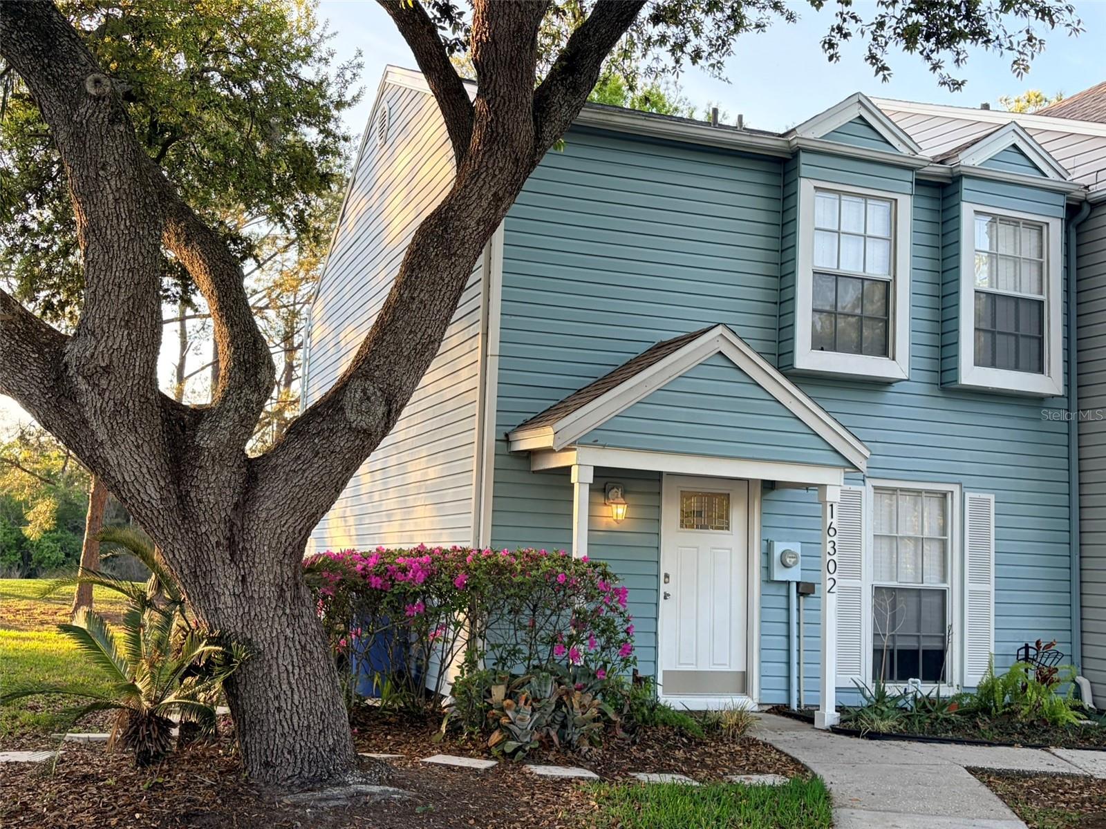 Love to Golf? This townhouse is on the 9th hole of Northdale Golf Course. This end unit home offers upgraded doors and wood plank tile downstairs. What is done for you already? Primary bathroom redone -check (2020), Roof-check (2023), Water Heater-check (2023), AC and AC duct work-check (2024), Upstairs bathroom renovated-done (2025), Kitchen (new cabinets, granite, backsplash, lighting, and garbage disposal)-check (2026)  Location, location, location is easily accessible from N. Dale Mabry and the Veterans'.  The roof and hot water heater were replaced in 2023, not 2024 as on Seller Disclosure. This home is move in ready.
Subdivision is Villas of Northdale, but the entrance signs say Country Mill. Like everything else, looks better in person! Come check it out!