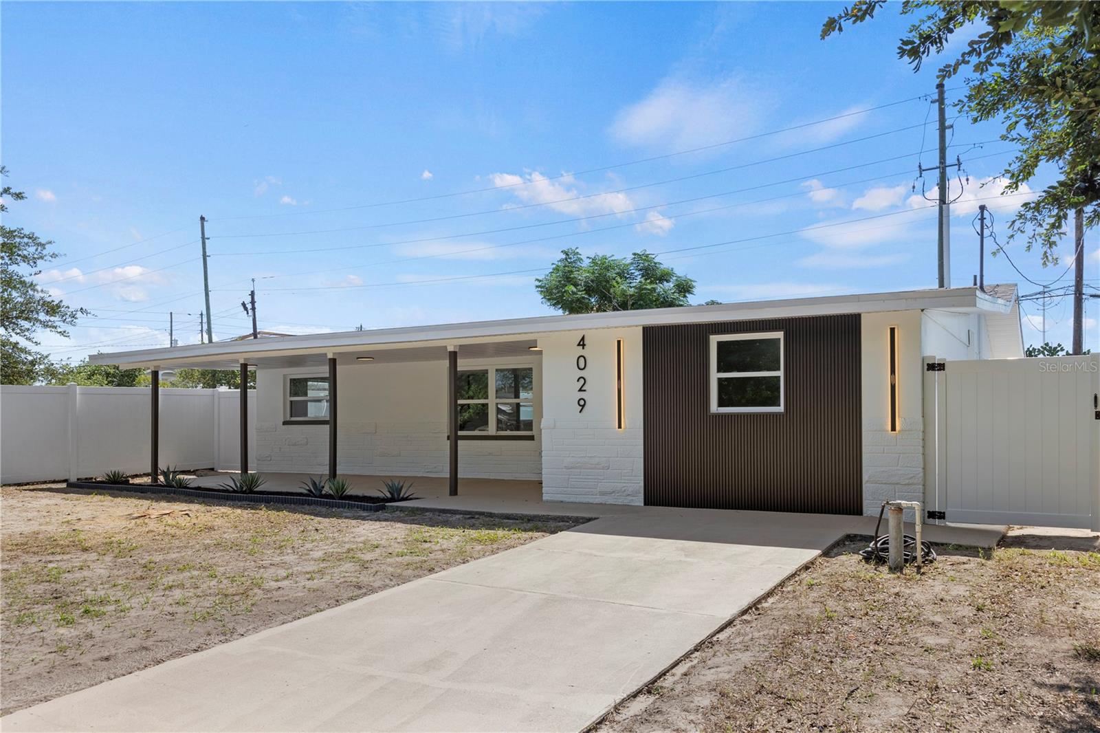 Welcome to the home that truly has it all! This beautifully renovated 3-BEDROOM, 2-BATHROOM residence perfectly blends modern style, comfort, and functionality. NO HOA! NO FLOOD ZONE! LOW PROPERTY TAXES! NO DEED RESTRICTIONS! Enjoy complete peace of mind with a BRAND-NEW ROOF (2026), NEW HVAC SYSTEM (2026), NEW WATER HEATER, NEW DOUBLE-PANE WINDOWS, NEW DOORS, AND FRESH INTERIOR & EXTERIOR PAINT. Step inside to a bright, open-concept living space featuring LUXURY VINYL PLANK (LVP) FLOORING, elegant gold finishes, and an abundance of natural light. The stunning chef's kitchen is the centerpiece of the home, showcasing SHAKER CABINETS, QUARTZ COUNTERTOPS, AND BRAND-NEW STAINLESS STEEL APPLIANCES, making it perfect for everyday living and entertaining. Both bathrooms have been completely remodeled with modern finishes, while the oversized third bedroom features a private bath so spacious and luxurious that it can easily serve as the PRIMARY SUITE. The fully fenced backyard offers exceptional privacy and plenty of room for entertaining, pets, or creating your own outdoor oasis. Conveniently located JUST 1 MINUTE FROM US-19, you'll enjoy quick access to parks, recreation centers, shopping, dining, historic Downtown New Port Richey, beautiful Gulf beaches, hospitals, and both Tampa International and St. Pete-Clearwater airports. This is a rare opportunity to own a move-in-ready home that feels brand new while enjoying the very best of the Florida lifestyle.