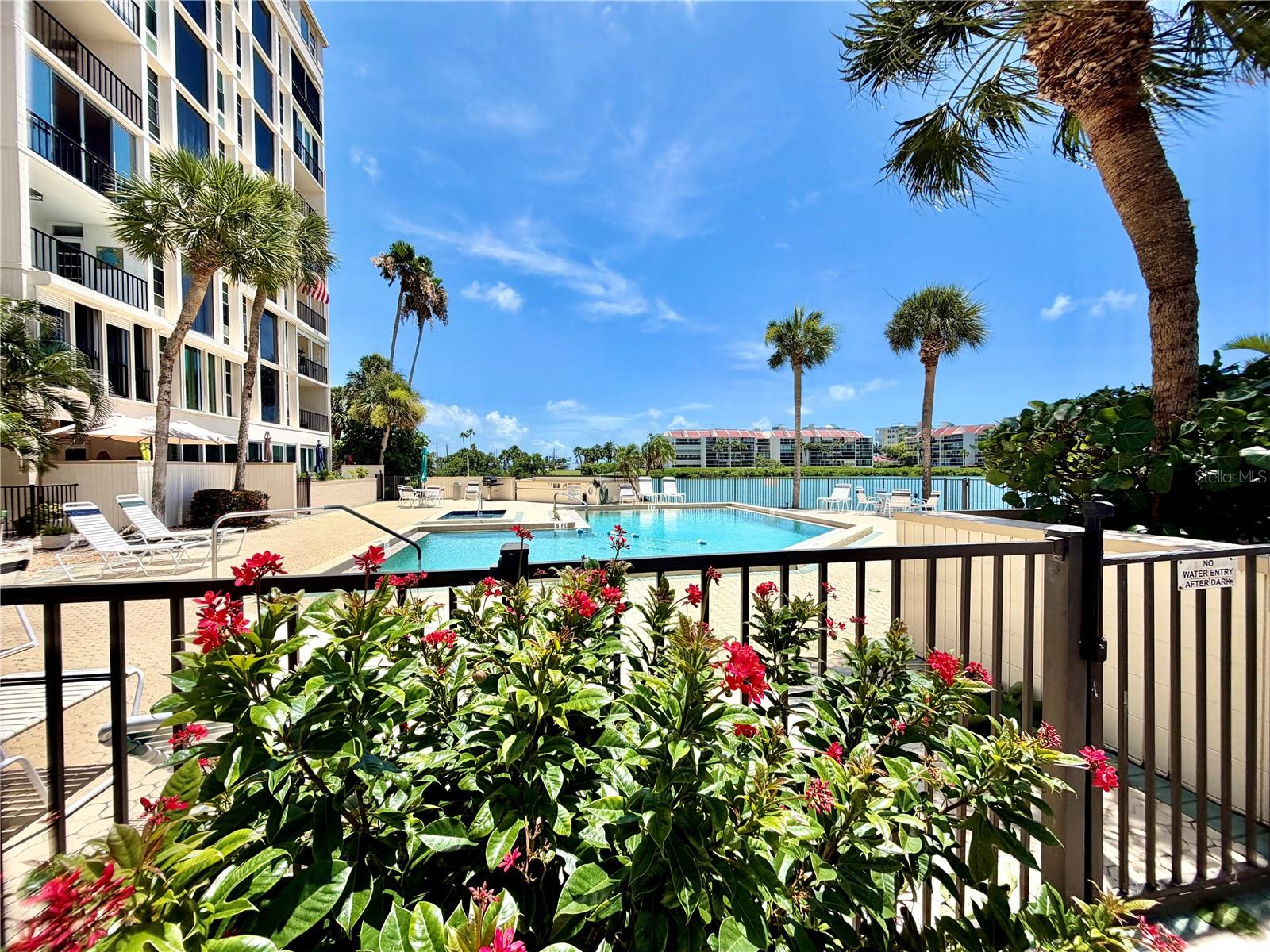 Virtually Staged. ### Waterfront Luxury Meets Resort-Style Living in South Pasadena

Welcome to **7400 Sun Island Drive S, Unit 111**, a beautifully updated **2-bedroom, 2-bath waterfront condominium** nestled within the highly sought-after **55+ gated community of Bay Island**. This first-floor end unit offers the perfect blend of comfort, convenience, and coastal lifestyle with breathtaking water views and an abundance of natural light.

Step inside to discover an inviting open-concept layout featuring a spacious living and dining area, stylish tile flooring, ceiling fans throughout, and a bright kitchen complete with **granite countertops, stainless steel appliances, two-tone cabinetry, and a charming breakfast nook**. Both bathrooms have been tastefully updated with granite countertops and modern vanities, while the primary suite offers a walk-in shower and private access to one of two outdoor patio spaces. The guest bathroom features a walk-in therapeutic tub for added comfort and accessibility.

Enjoy Florida living at its finest with **two private patio areas**, including a peaceful retreat off the primary bedroom and an additional paver patio accessible from the living area—perfect for morning coffee, evening sunsets, or simply enjoying the waterfront setting.

Bay Island is renowned for its resort-style amenities, including:

* 24-hour gated security
* Six heated swimming pools
* Two hot tubs
* Clubhouse and social activities
* Fitness center
* Tennis and pickleball courts
* Marina and fishing areas
* Scenic waterfront walking paths
* Billiards, card rooms, and hobby spaces
* Active social calendar and community events

Ideally located just minutes from **St. Pete Beach, Corey Avenue shops and dining, Gulf beaches, downtown St. Petersburg, and endless entertainment options**, this home offers the perfect opportunity to enjoy maintenance-free waterfront living in one of Pinellas County's premier active adult communities.

Whether you're looking for a seasonal retreat or a full-time residence, this move-in-ready waterfront gem delivers the lifestyle you've been dreaming about. Schedule your private showing today!