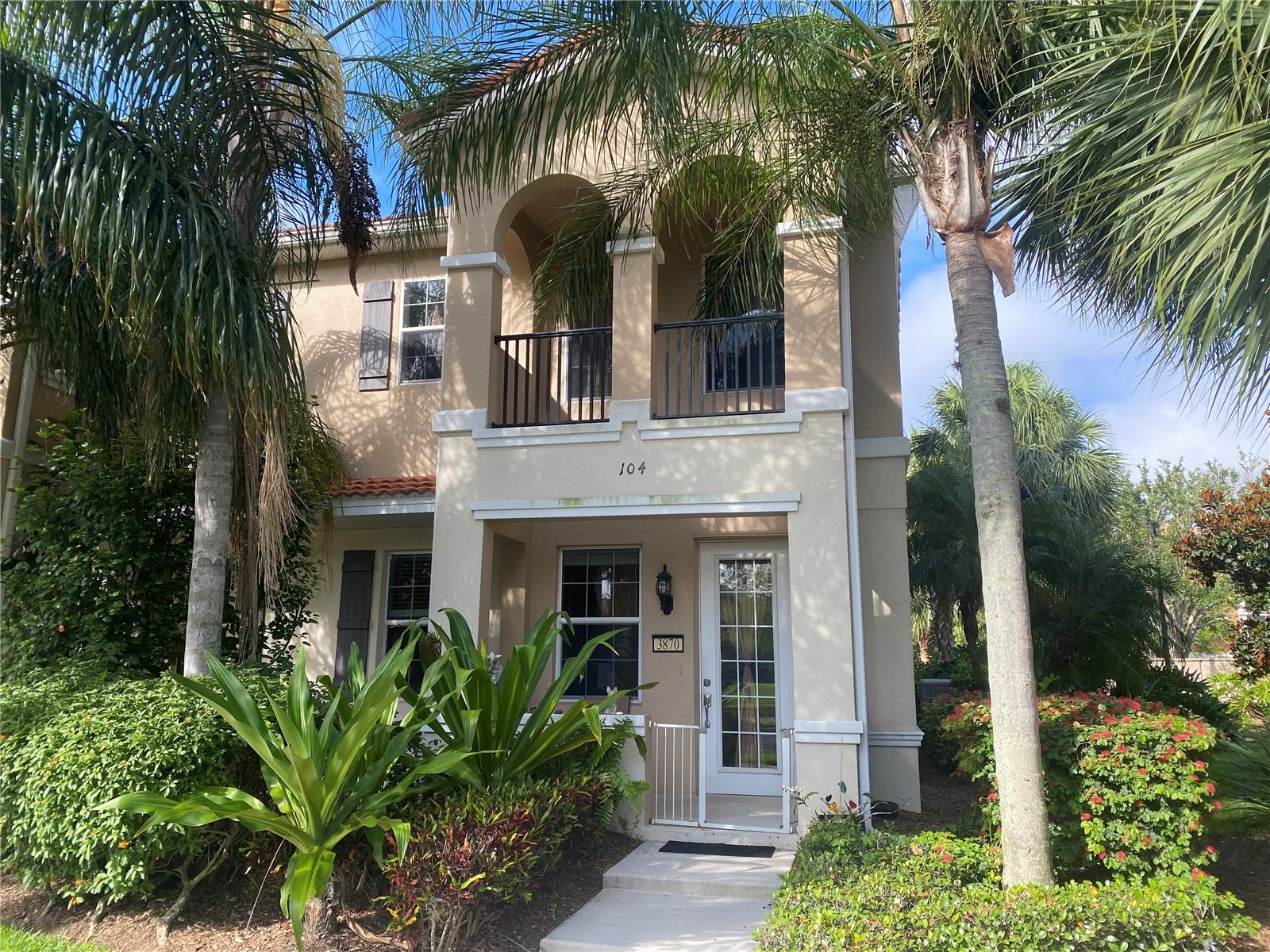 Located near University Parkway, this *end unit* offers lake views and a backyard grassy area. Downstairs, you'll find a living room, a contemporary kitchen with solid wood cabinets and Corian countertops, a laundry room, and a half-bath. Upstairs, you’ll find a spacious master suite with a king bed, walk-in closet, and a double-sink master bath, plus two additional bedrooms and a second full bathroom. All essential services are within easy walking distance or a short drive. Community amenities include pool, playground, tennis courts, BBQ grills, community green, and lush landscaping. The pet-friendly property also includes a one-car garage with EV charging, and a driveway which fits two more cars side-by-side. Available for leases of 7 months to a year.