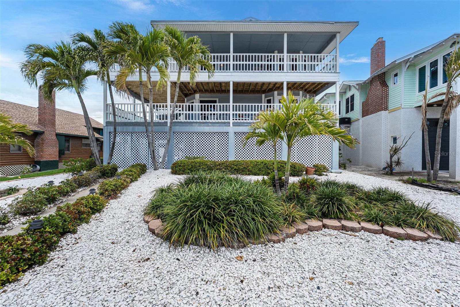 Custom Coastal Retreat with Gulf & Johns Pass Views • Private Primary Suite • Wraparound Decks • Beach Access • Reinforced Construction  

Welcome to your private coastal retreat in the heart of Treasure Island, where relaxed beachside living meets thoughtful design, exceptional craftsmanship, and modern comfort. Lovingly maintained by the original owners, this remarkable residence stands as a testament to quality construction and pride of ownership. After purchasing the property in 1979, the owners removed the existing home and built the stunning custom residence that stands today. Engineered for peace of mind, the home is supported by reinforced concrete piers extending more than 20 feet into bedrock, providing a solid foundation. A recent 4-Point Inspection has been completed with a clean report, offering added confidence to prospective buyers. The report is attached in the MLS for review. This spacious 4-bedroom, 3-bathroom home offers an ideal blend of luxury, functionality, and effortless indoor-outdoor living. Step inside to discover a well-appointed floor plan filled with natural light and luxurious touches throughout, creating inviting spaces designed for both everyday living and entertaining. Outdoors, escape to your own resort-style setting featuring a private pool, perfect for refreshing dips after a day at the beach. For added convenience, an outdoor shower with hot water is perfectly positioned poolside. Just off the Primary Suite is an expansive bonus room that can serve as a private office, reading retreat, fitness space, or third-story sitting area with elevated views. The primary bathroom features dual vanities, a walk-in closet, and access to a large attic storage area. The main living level offers three bedrooms, an updated bathroom, spacious living room with custom bookcases, bedroom that easily could be a Florida room/den, and a formal dining room. The upgraded kitchen features include granite countertops, wood cabinetry, breakfast counter seating, and a separate pantry/laundry room. Expansive wraparound decking creates exceptional indoor-outdoor entertaining space. The oversized 2-car garage is complemented by a dedicated workbench and storage for jet skis, or golf cart. A versatile bonus room off the garage has its own bathroom, offering endless possibilities as home office, creative studio, fitness room, or guest overflow space. Multiple decks invite you to relax and enjoy gentle coastal breezes and serene water views, delivering the ambiance of waterfront living without the premium. The crown jewel is the third-story balcony, showcasing beautiful views of the Gulf and the boats entering and departing from Historic Johns Pass. It's the perfect backdrop for morning coffee, afternoon relaxation, or spectacular sunset evenings. Ideally located, you can stroll to Johns Pass to enjoy waterfront dining, boutique shopping, entertainment, and boating adventures just moments from your door. Whether you're seeking a full-time residence, or a prime investment opportunity, this Treasure Island gem captures the very best of Florida coastal living — exceptional construction, breathtaking views, an unbeatable location, and a lifestyle that's second to none. Be sure to check out the video tour and experience everything this extraordinary home has to offer!