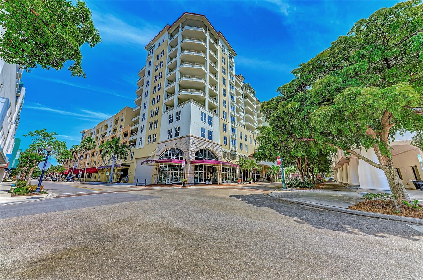 100 Central Avenue — Where Downtown is Downstairs. Live in the center of Sarasota’s most vibrant luxury lifestyle from this beautifully updated and FULLY FURNISHED residence at one of downtown’s most iconic addresses. Residence H716 offers 1,725 square feet of refined living with 2 spacious en-suite bedrooms, 2.5 bathrooms, a versatile den, and an expansive private balcony showcasing captivating city and bay views. Inside, warm dark hardwood flooring, custom cabinetry, granite countertops, and thoughtfully designed living spaces create a residence that feels both elegant and comfortable. The open-concept layout flows effortlessly for entertaining, while floor-to-ceiling natural light enhances the home’s inviting atmosphere. Recent updates include a NEW 2025 washer and dryer, along with a NEW 2024 refrigerator and water heater. What truly separates 100 Central is the lifestyle. Step downstairs directly into the heart of downtown Sarasota — where Whole Foods, Starbucks, award-winning restaurants, boutique shopping, the Sarasota Opera House, Florida Studio Theatre, and vibrant nightlife are all just outside your door. Marina Jack, Bayfront Park, St. Armands Circle, and Lido Beach are only minutes away. Residents enjoy an impressive collection of resort-style amenities, including a 24-hour concierge and secured access, a heated pool and jacuzzi, a fitness center, a private movie theatre, a resident club room and art studio, guest suite accommodations for visitors, and pet-friendly living. A standout feature rarely found downtown is the inclusion of TWO secure under-building parking spaces located high and dry on the 4th floor, along with additional storage. Whether you’re searching for a full-time residence, seasonal retreat, or luxury lock-and-leave lifestyle, Residence H716 delivers exceptional convenience, privacy, and walkable city living in the cultural heart of Sarasota.