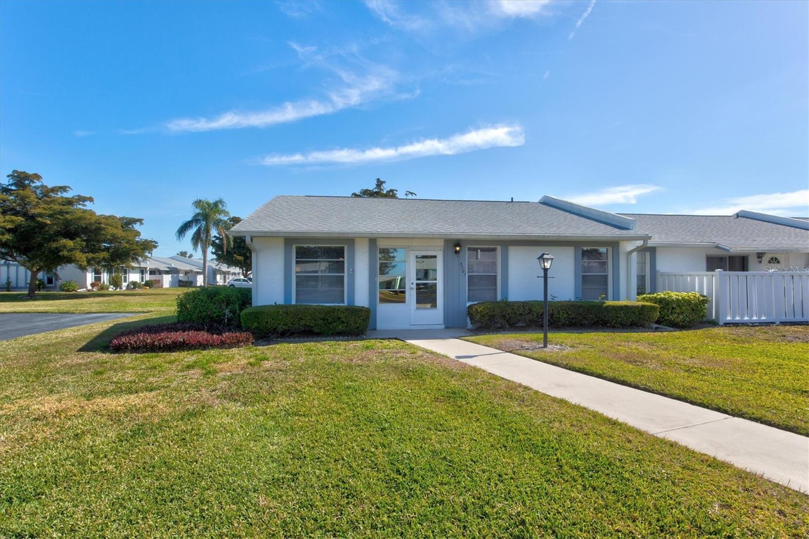 Welcome to sought-after Cortez Villas Section 11, one of West Bradenton’s most established and well-maintained 55+ communities—now offering an incredible opportunity at just $180,000! This spacious end-unit villa features one of the largest floorplans in Cortez Villas, with 2 bedrooms PLUS a den/study with full closet, ideal for a guest room, home office, hobby room, or possible third sleeping space.
Inside, you’ll love the light and bright open feel created by vaulted ceilings and additional end-unit windows. The flexible layout lives comfortably year-round while also making an ideal Florida winter retreat. Major updates include a NEW A/C SYSTEM (2025) and water heater (2014), offering added value and peace of mind. The kitchen has been refreshed from prior updates, and some furnishings may convey for buyer convenience.
Enjoy easy, low-maintenance living with two assigned parking spaces directly outside your door, plus close proximity to the heated community pool and clubhouse. The affordable $479/month HOA fee includes exterior maintenance, grounds care, cable, internet, water, sewer, trash, and community amenities—with NO current assessments.
Located in the heart of West Bradenton, this villa is just minutes from Anna Maria Island beaches, shopping, restaurants, medical facilities, GT Bray Park, and everyday conveniences. Whether you’re searching for an affordable Florida retirement home, seasonal residence, or full-time low-maintenance lifestyle near the Gulf Coast, this property delivers exceptional value in a stable community.
Affordable villas near the beach at this price are becoming harder to find—schedule your private showing today!
