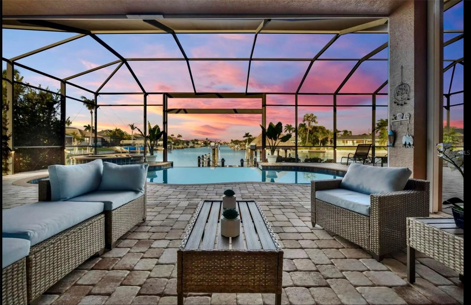 LOCATION, LOCATION!  IN DIRECT GOLF ACCSESS, only 2 bridges, very rare to find. Fully Furnished! Ready To Quick Move In. Turnkey! Wide Salt Water Access Canal and into the Sunset. Perfekt for Investors, Perfekt for Short Term Rentals. New Metall Roof 2023. Hurricane Impact Windows and sliding Doors. IT is not just a residence—it is a strategic foothold in one of Southwest Florida’s most resilient coastal growth markets, suitable for portfolio diversification, wealth preservation, or future redevelopment positioning. A View, Beautiful Sunsets over the Water. This is a Newly Updated spacious Open Floorplan home with 4 Bedrooms, 3 full baths. Kitchen has all new solid wood cabinets w/soft close doors and drawers, built in Microwave and Wall Oven. Countertop Touch Cook Surface with no knobs, New Matching Quarts Countertops in Kitchen & all 3 Baths with New Matching Vanities. New Flooring throughout with Freshly Painted Interior. No detail overlooked. One En-suite Guest bedroom plus an oversized 3rd bedroom. Master Bedroom and Bath are Spacious, with large walk-in closets and separate Tub/Shower. Living, Dining and Kitchen offers plenty of room for entertaining. This opens to an Outdoor Kitchen and Under Truss Lanai looking over the Spa/ Infinity Edge Pool and directly down the Large 27x24 Sunning area at end of pool. Electric Roll Down Screens for added protection and Security. Dock with good sized Tiki for Relaxing. Home Includes, Generator, Heated Pool/Spa, Central Vac, Lots of New Appliances, Garage W/AC & Epoxy Floor, Hurricane Impact Windows and Impact Sliding Doors and much more. Tastefully Decorated and ready for You. This home This villa will delight you!  Did I mention The VIEW. in one of SW Cape Coral’s most established residential corridors, this property represents a rare blend of location security, long-term appreciation potential, and flexible investment upside in Southwest Florida’s consistently growing real estate market.
Set on a generous ~10,000 sq ft residential lot, the home offers a solid structural foundation for value enhancement strategies—whether through modern renovation, rental optimization, or long-term hold in a supply-constrained market where well-located parcels continue to tighten.
The surrounding area is characterized by stable ownership patterns, strong neighborhood fundamentals, and proximity to key lifestyle infrastructure including Veterans Memorial Parkway, Chiquita Blvd, retail corridors, and bridge access to Fort Myers and the broader Gulf Coast economy. This ensures both livability and liquidity—two critical drivers for high-net-worth real estate allocation decisions.
From an investment perspective, Cape Coral continues to benefit from sustained in-migration, strong rental demand, and limited infill opportunities in established sections like this one. Properties in this micro-location are increasingly viewed as “land-bankable assets with optional lifestyle use”, appealing to both domestic and international buyers seeking USD-denominated real estate exposure.
Zoned within the Lee County School District, the property also maintains appeal for end-user families, further strengthening exit liquidity and resale resilience across market cycles.