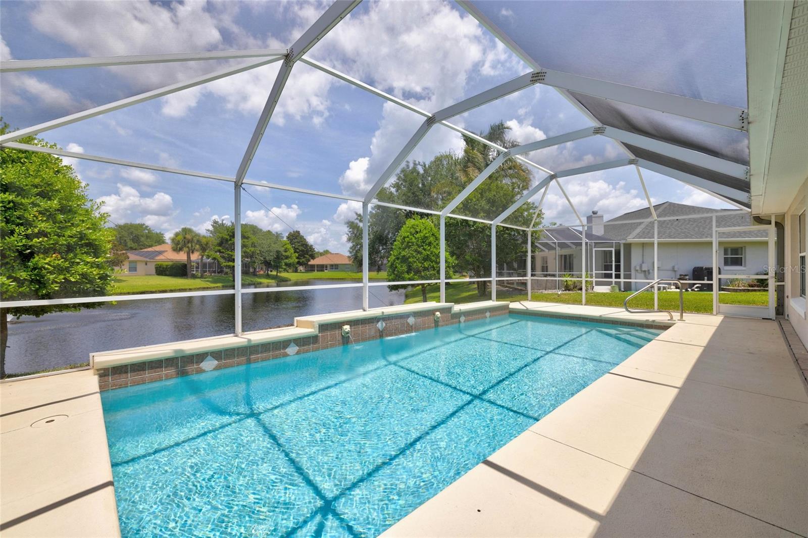 Lakefront concrete block pool home on an oversized lot in the desirable Commodore's Club subdivision! Step inside and discover tons of natural light and a view of the pool from almost every room. The well designed layout includes a formal dining room, an inviting gathering room, and an open kitchen with a charming breakfast nook- as well as 3 bedrooms, 2 bathrooms and a 2 car garage. Two sets of triple sliders within the fully heated and cooled Florida room lead to your screened in-ground pool overlooking an oversized lake. The neighborhood is nestled off  of A1A with easy access to the ocean, Intracoastal, and downtown St. Augustine. Community offers pool, pavillon, tennis court and basketball court - with no CDD fees. Roof has been replaced in 2017.