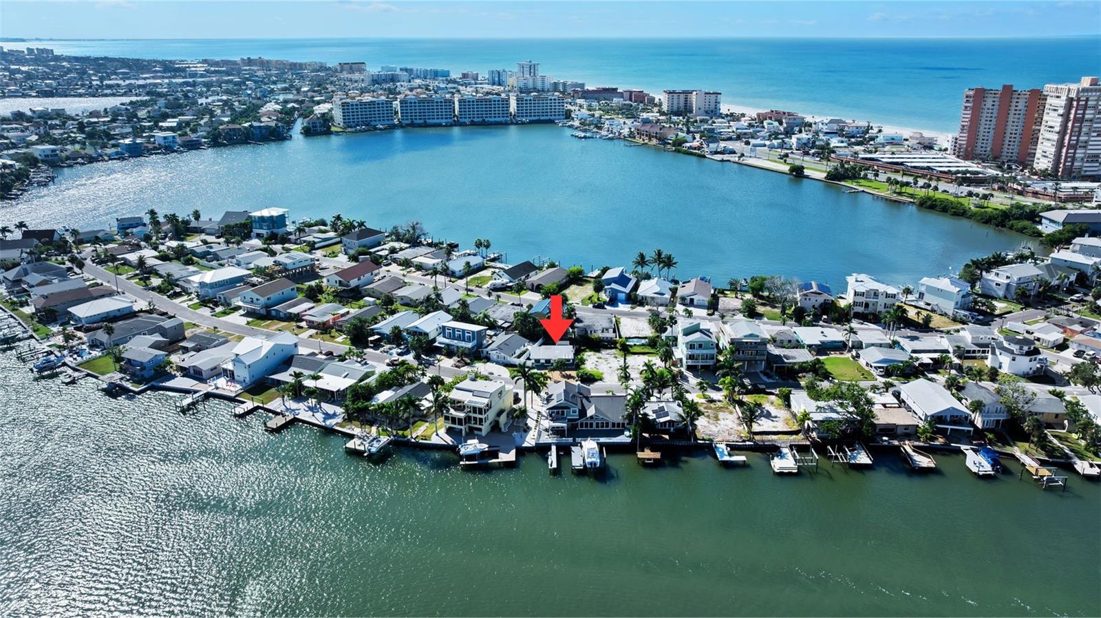Virtually Staged. Seller is ready to get this home sold! This gorgeous 2-bedroom, 1.5-bath residence is a short 5-minute walk to Redington Shores beaches with a peek-a-boo view of the intercoastal and offers a wealth of features that exceed expectations and embrace the essence of modern living. This home was immediately remediated after the 2024 storms and has been thoughtfully renovated with all work permitted, inspected and permits closed by the city of Reddington Shores. Discover a sanctuary that perfectly balances style and practicality! This home showcases upgrades throughout, including waterproof lower cabinets, and durable waterproof Endura removable walls and baseboards, all designed to give you peace of mind for the future. With brand-new appliances and fresh paint that radiates a coastal vibe, along with a new HVAC system, newer tankless water heater and all new electrical wiring and electric panel, every corner of this home has been crafted to ensure your comfort and peace of mind. The current flood policy is also assumable. Imagine stepping out into your own pocket of paradise, where the outdoor space has been designed for your ultimate enjoyment. Picture a beautiful outdoor area with pavers that serves as the perfect foundation for your outdoor furniture, inviting you to lounge in comfort while soaking up the sun. Envision the luxury of having a private outdoor shower, providing a refreshing retreat after a day spent frolicking on the beach or tending to your garden. The convenience of a 220V power outlet awaits, ready to accommodate your dreams of an outdoor hot tub, where you can unwind under the stars. Plus, with an 8'x12' utility shed, storage is effortlessly managed, ensuring your outdoor oasis remains uncluttered and serene. This is not just a space; it's a lifestyle where relaxation and entertainment seamlessly intertwine, making every gathering with friends and family a cherished memory. Experience the best of Florida living from the vibrant heart of Redington Shores, where the tropical beaches are just moments away, inviting you to soak in their natural beauty. Picture leisurely days spent lounging by the shore, followed by delightful evenings exploring the diverse array of local shops and dining options that cater to every palate. As a resident of the Surfside community, you also have the opportunity to join ($40.00 per year) the Surfside Beach Club. This gives you access to a private beach club with parking, picnic and barbecue areas. The convenience of living just a stone's throw away from the Tom Stuart Causeway provides easy access to St Petersburg and surrounding Tampa Bay areas. Don't wait to Start Living today! Call to make an appointment and make this home your own.