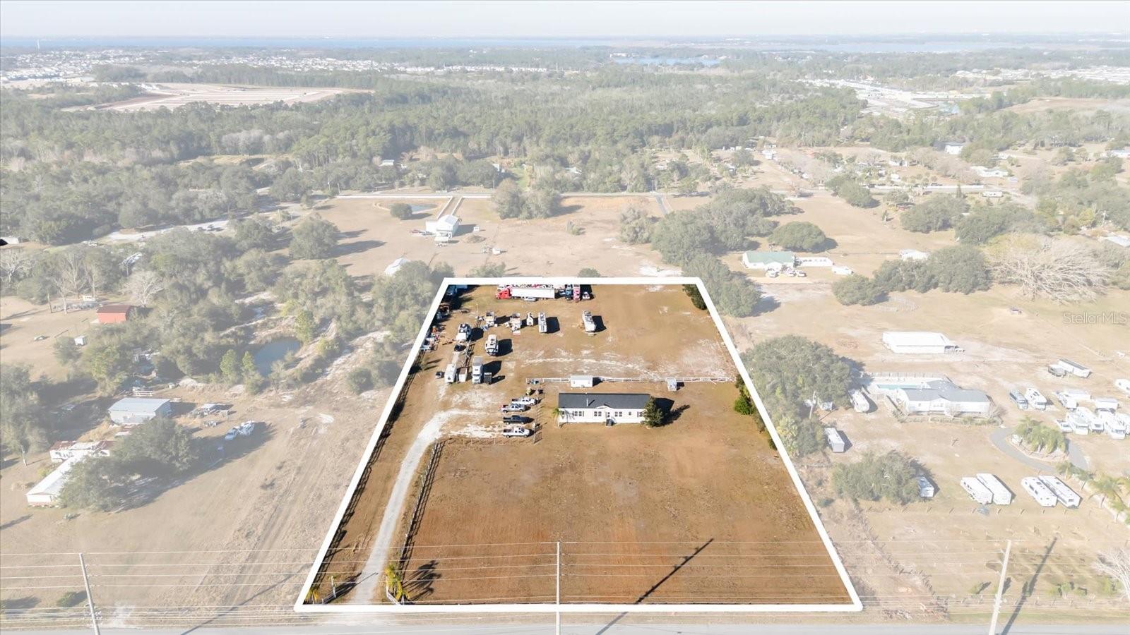 Discover the ideal balance of space, privacy, and convenience with this 4.409-acre rural residential property in Saint Cloud, just southeast of Orlando and minutes from Lake Nona. High, dry, and cleared, this versatile acreage offers wide-open living with the rare ability to split into two separate lots, making it perfect for future investment, multi-generational living, or added flexibility.
Zoned Rural Residential, the property allows farm animals, giving you the freedom to create a small homestead, hobby farm, or simply enjoy the peace and breathing room that only acreage can provide. With ample space to spread out, it’s ideal for families seeking a quieter lifestyle while remaining close to Central Florida’s key destinations. Modular Home does not convey.

A driveway extending to the back of the property adds convenience and accessibility. Additional improvements include a 12x20 shed with electricity—ideal for storage or a workshop—plus an 11x33 shed for even more storage.
Enjoy the charm of rural living with easy access to Highway 417, Lake Nona Medical City, major hospitals, Orlando International Airport, and world-famous attractions. Outdoor enthusiasts will love nearby East Lake Tohopekaliga, trails, biking, and kayaking, while shopping, dining, and entertainment await at Lake Nona Town Center and Boxi Park.
This property delivers a rare combination of acreage, comfort, and prime location—an exceptional opportunity to own a peaceful retreat close to the heart of Central Florida.