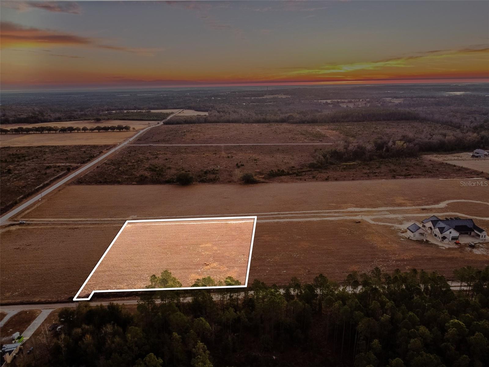 An exclusive opportunity in one of Hernando County’s newest gated estate enclaves. This exclusive Community will feature only 10 total estate lots, with just 9 remaining, as one homesite is already under construction— this is a rare chance to secure a private three-acre estate lot designed for those who want space, privacy, and the freedom to build something truly exceptional. The community is planned to be gated, with a private paved road and curated landscaping to be installed, creating a refined and cohesive estate setting. Homes within the subdivision must be Modern Country Craftsman in design, with minimum square footage requirements between 5,000 and 10,000 square feet under roof, ensuring architectural consistency throughout the community. This neighborhood was thoughtfully created for buyers who appreciate craftsmanship, space, and lifestyle — including those looking to design expansive garages for luxury vehicles, exotic sports cars, or curated collections. The generous acreage allows for custom floorplans, oversized garages, and resort-style outdoor living. With limited availability, premium lot sizes, and strict architectural standards, this subdivision represents a true estate-level offering — where privacy, prestige, and possibility meet. Offering the feel of true country living yet located just minutes from the charm and conveniences of Brooksville, it provides the perfect balance of seclusion and accessibility. Enjoy easy access to I-75 (approximately 20 minutes), the 589 Expressway (approximately 15 minutes), and a drive of under an hour to Tampa International Airport, making both daily life and travel effortless. Opportunities like this don’t come often. Secure your place among a select group of owners and build the legacy home you’ve been waiting for.