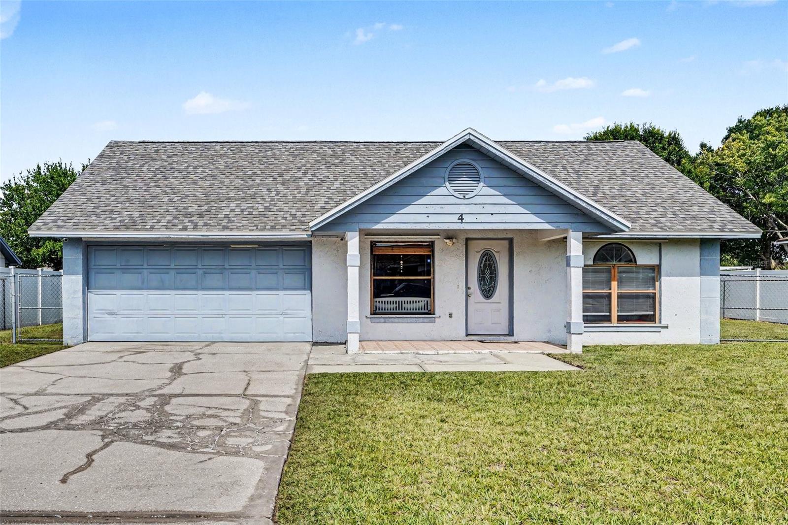Welcome to a beautiful blend of comfort and lifestyle at 4 Carmona Way, a charming one-story retreat tucked away in a peaceful Kissimmee neighborhood. Situated on a generous 11,195 SqFt lot, this property offers plenty of outdoor space to enjoy Florida living. From the moment you step inside this 3-bedroom, 2-bathroom single-family residence, the bright natural light, soaring ceilings with elegant skylights, and a cozy wood-burning fireplace make you feel right at home. The thoughtful 1,676 heated square-foot layout features a spacious primary bedroom with a generous walk-in closet, offering the perfect private sanctuary. The heart of the home flows seamlessly into the kitchen with well-equipped appliances. Step through the sliding doors into your large, fully fenced private yard, an ideal space for weekend gatherings, gardening, or relaxing under the Florida sun. Conveniently located in close proximity to the local post office and a proposed new shopping mall, this home offers added convenience and exciting future growth potential. Located just a short drive from Orlando's world-class theme parks, major attractions, shopping, and dining, the property also features incredible community amenities with a low monthly association fee. Whether you are looking for a primary residence, investment opportunity, or vacation getaway, this property is ready to capture your heart.