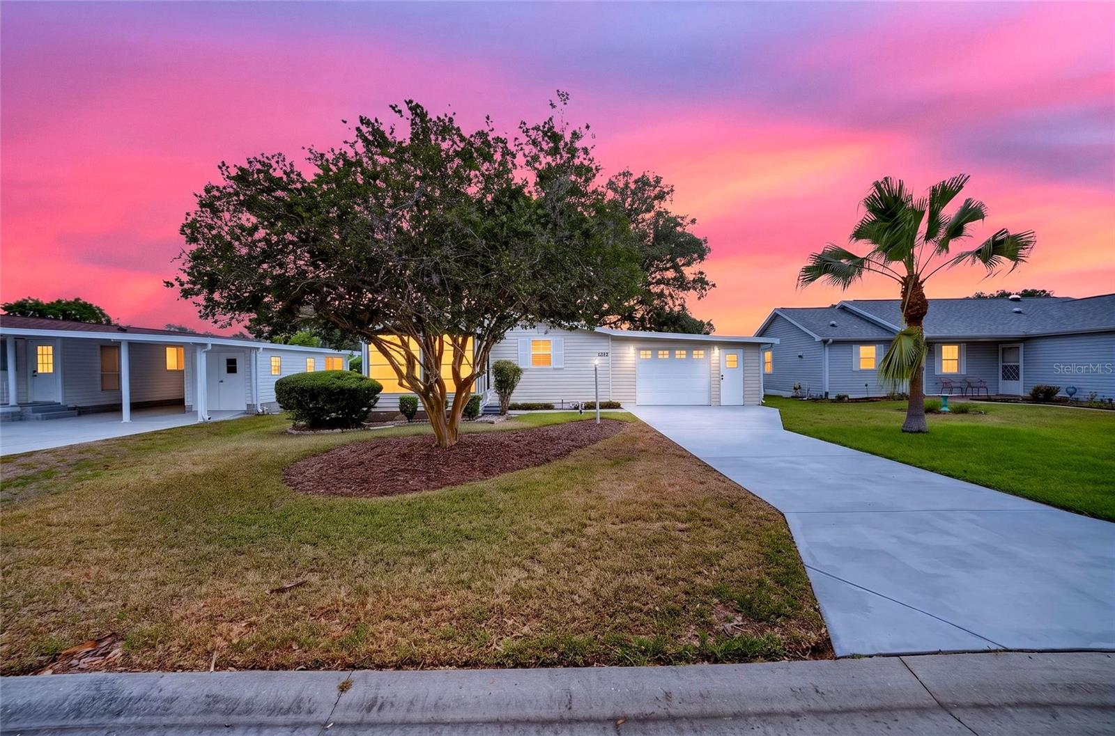 MOVE-IN READY TURNKEY HOME...FULLY FURNISHED!!! WITH NO BOND AND NO CDD! Adorable 2-bedroom, 1-bath home with a 1-car enclosed garage, workshop, and spacious Florida Room located in ORANGE BLOSSOM GARDENS, where everything is just minutes away by golf cart or walking distance, including SPANISH SPRINGS TOWN SQUARE, shopping, dining, medical facilities, entertainment, CHULA VISTA AND MIRA MESA EXECUTIVE GOLF COURSES, and the RIO GRANDE FAMILY POOL. Conveniently located less than 4 miles from LAKE SUMTER LANDING TOWN SQUARE and less than 10 miles from BROWNWOOD PADDOCK SQUARE, all offering FREE nightly entertainment, movie theaters, shopping, and dining. Enjoy The Villages lifestyle with complimentary golf on all executive golf courses year-round, access to Villages Golf and Country Clubs, over 2,000 special interest clubs, and endless recreational opportunities. This lovely, manufactured home features NEW AC 2023 and NEW WATER HEATER 2018, separate laundry room in the garage with workshop space, spacious eat-in kitchen, bright living/dining room with large windows for natural light, and neutral full bath with solar tube. Affordable living in The Villages without breaking the bank! Imagine retiring to sunny Central Florida and enjoying a life of leisure, entertainment, recreation, and relaxation from the comfort of this charming fully furnished home. THIS HOME IS A MUST SEE!