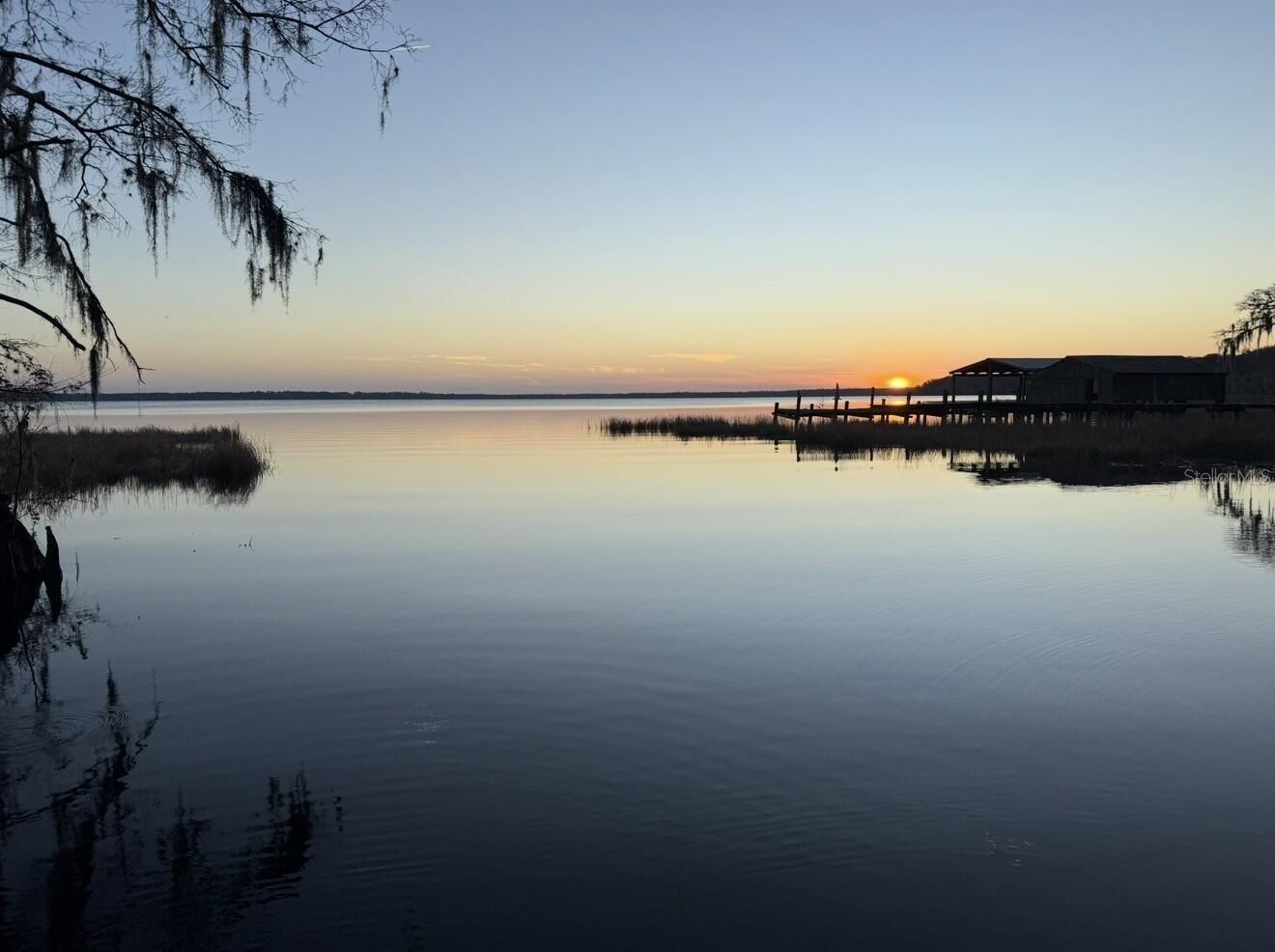 Extremely Rare Opportunity. There are only 29 waterfront homesites in existence along Lake Disston Drive, and just a handful remain undeveloped. This nearly 2-acre homesite has approximately 100 feet of shoreline on pristine Lake Disston, with a desirable point-lot setting that provides exceptional water views and added privacy.
The 1,844-acre lake is not only one of the largest lakes in this part of Florida but is so pristine that the Florida Department of Environmental Protection designated it an “Outstanding Florida Waterway” due to its remarkable water quality and the abundance of old-growth cypress forest stretching more than six miles around the lake. A fabulous ski lake with very little boat traffic, Lake Disston also has outstanding fishing with healthy populations of largemouth bass, shellcracker, and crappie. It also supports nesting Ospreys, Bald Eagles, and Sandhill Cranes, along with a major rookery along the northern shore that teems with hundreds of wood storks, ibises, and egrets. Public boat ramp access is located less than a minute down the road, making it easy to enjoy. The property features paved road frontage for convenient year-round access, and the sellers have a recent boundary survey available for review, helping simplify the building process.
This peaceful Old Florida setting is tucked into the far southwest corner of Flagler County, just 30 minutes from Palm Coast and Ormond Beach and less than 20 minutes from Bunnell. Opportunities to own one of the few remaining waterfront homesites on Lake Disston are becoming increasingly rare. This may truly be a once-in-a-lifetime opportunity to build your dream lakefront estate.

More photos coming soon!