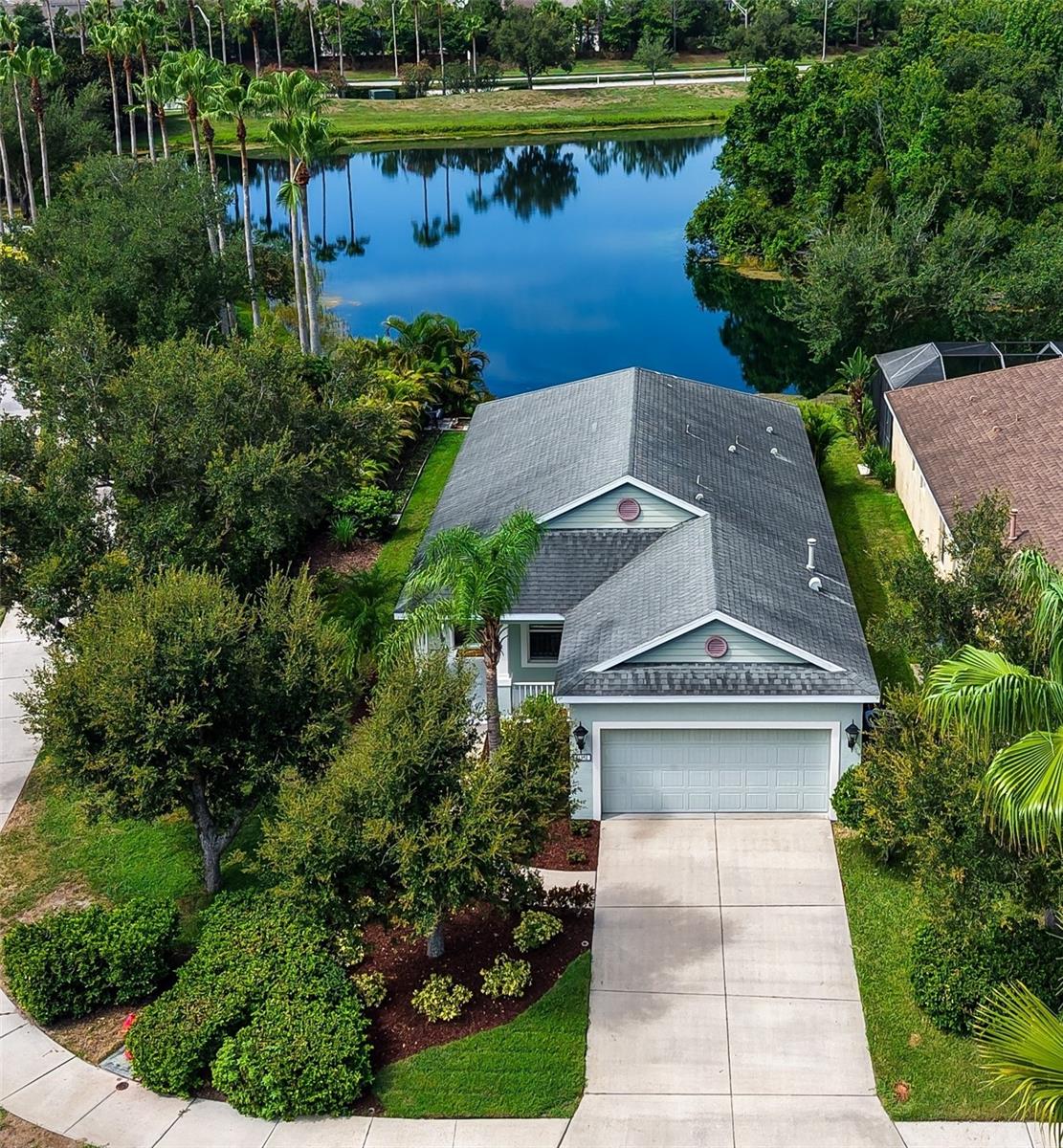 Welcome to this meticulously maintained 3-bedroom, 2-bath home in the highly desirable gated community of Central Park at Lakewood Ranch, where coastal-inspired style, beautiful landscaping, and an exceptional family-friendly lifestyle come together. Situated on a premium corner lot, this move-in-ready home enjoys a long, tranquil lake view framed by mature landscaping, creating a private and peaceful backdrop rarely found in the community.
Inside, you'll immediately appreciate the light and airy coastal feel, open-concept floor plan, and thoughtfully designed split-bedroom layout that offers privacy for both owners and guests. The spacious great room flows seamlessly into the kitchen and living areas, while a separate dining room provides the perfect space for holiday gatherings, dinner parties, or everyday family meals. New carpet in two of the bedrooms adds to the home's fresh, move-in-ready appeal, and the pride of ownership is evident throughout.
Step outside to the screened lanai, where you'll enjoy your morning coffee or unwind in the evenings while taking in the peaceful lake views and lush landscaping. The combination of the oversized corner homesite, mature greenery, and long water views creates a private outdoor retreat that is perfect for relaxing or entertaining.
Central Park is one of Lakewood Ranch's most sought-after gated communities, known for its mature landscaping, scenic lakes, and welcoming neighborhood atmosphere. Residents enjoy outstanding amenities including a 10-acre park, splash pad, adventure playground, tennis courts, two dog parks, picnic pavilion, and miles of sidewalks perfect for walking, biking, and enjoying the outdoors. Families especially appreciate the close proximity to B.D. Gullett Elementary School, nearby Lakewood Ranch schools, and the abundance of parks and green spaces throughout the community.
Conveniently located just minutes from Main Street Lakewood Ranch, Waterside Place, University Town Center, championship golf, top-rated medical facilities, and Florida's world-renowned Gulf Coast beaches, this home offers the perfect combination of location, lifestyle, and value.
Whether you're looking for your first home, a seasonal retreat, or a place to enjoy the award-winning Lakewood Ranch lifestyle, this beautifully maintained Central Park residence offers an exceptional opportunity in one of the area's most established and desirable neighborhoods.