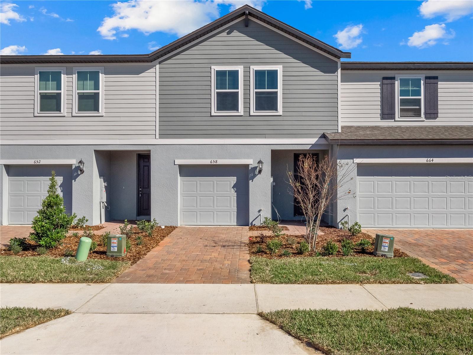 This 3 bed 2.5 bath townhome is located within walking distance of Reunion Village and just a little bit further to downtown Champions Gate where you will find an abundance of shops and restaurants.This area has grown significantly over the past few years and more shops and restaurants have been added this year. The townhome comes with a 1 car garage with an automatic door opener. Enjoy true privacy your rear yard overlooks a lush wooded conservation area.. As you enter you will love the open floor plan. The kitchen has a walk in pantry, 42 inch white shaker cabinets, granite counter tops and stainless steel appliances. There is a large kitchen island which can easily accommodate some bar stools to enjoy your meals. The half bathroom is located downstairs. There is no carpet on the 1st floor of this unit. On the 2nd floor you will find a good sized loft area which could be used as a place to work on have a small office. 2 of the bedrooms share the hall bathroom which has a tub with overhead shower, single vanity and granite counter tops. The master bedroom is very spacious with plenty of natural light and an extra large walk in closet. The master bathroom has a walk in shower with glass stall, his and her sinks. The community has a private children's playground and is just a short distance from exit 58 on the I4.