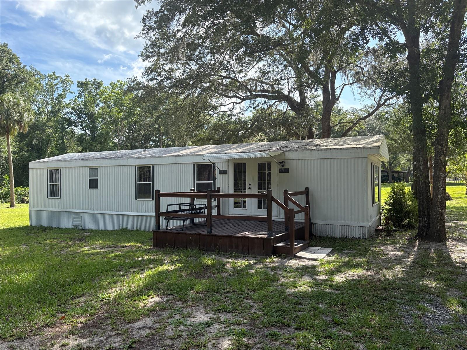 This is must see!! This is a 1984 2 bed 1 bath mobile that has been well cared for and gently lived in. The property sits at the end of a quiet street and is well over 1/2 an acre flanked by woods on 2 sides which offers the ultimate privacy. The property is freshly painted, has a new 2 car carport, brand new HVAC and clean as a whistle. Don't miss your chance to own this home at an incredible value!!! Call today for showing.