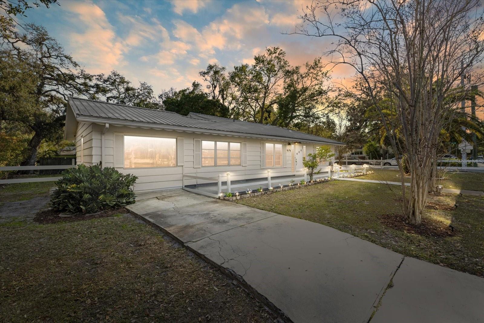 Executives' Paradise. Walk to Beach from "Upper SRQ" location, in Historic Coastal Community, near Little Indian Beach- Neighborhood Beach.  This 1947 built authentic original, in the Ringling Museum Area is near to SRQ Airport, and close to Sarasota's various Downtown attractions. Expansive room sizes, well built, and on oversized treed lot boasting huge front porch( 50' x 8' ), and semi private rear deck ( 20' x 10' )  for sunbathing.  Walk to public transit, short walk to Sunsets on the Bay, fishing, kayaking, relaxing by the beautiful waters of Sarasota's Bayfront.  Mature mango tree, china cherry trees, shady oaks, tropical palm trees and various exotic lush landscaping. Tough metal roofing system, post and rail fencing system, and security lighting surround this Stately Home. Huge rooms for entertaining and relaxing plus an oversized private office space/Art Studio, or possible 'in-law studio/library' etc. is away from the action, for the professional to work quietly. Chef's kitchen is larger than most and cooks with natural gas stove and oven. Natural gas is also energy efficient for the larger than most 40 gal.water heater.  Total package is efficient and in a most unusually spacious historic type of home.  *NOTE- Portable Kitchen Island + Fresh Produce Storage Bins + Bakers Rack can be included in sale. 
Pedestal sink and original porcelain tiles grace this oversized shower stall bathroom.  White with blue color bathroom.  Ceramic tiles throughout the home make this easy to keep, hygienic and clean. At end of day stroll out the front door to your 50' front porch, or take a short walk on shady tree lined sidewalk to watch the colorful sunsets on the waterfront.  Come home to "The Beachouse" . ( Potential as a handicap accessible residence dependant upon individual needs. Please preview for access to property amenities and interior rooms maneuverability.  Wide Hallway is 4' 3" x 11' 6" .to go between bedrooms and bathroom side of the home. ..Thankyou )
• Please note: Broker/Owner occupies access to premises until closing.  Quick-Close possible. 
Information is deemed reliable or accurate, but is not guaranteed.