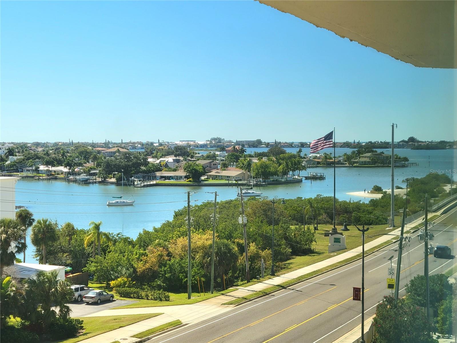 Looking for the perfect location to start living that Florida lifestyle? A tropical paradise awaits you in this highly sought after Harbour Club Condo located on the Intracoastal waterway in Belleair Bluffs! Community amenities include heated pool, fitness room, clubhouse, shuffleboard, BBQ grills, dock, fishing pier and breathtaking sunsets. This beautifully updated 2 bedroom, 2 full bath condo has all the bells and whistles. Bright and open floor plan with split bedroom layout, perfect for guests. The kitchen boasts beautiful quartz countertops, shaker style cabinets, all stainless steel appliances and a large open pass through that makes for the perfect space to entertain. Feel the pride of ownership as you relax in your spacious master bedroom, featuring a nice oversized walk in closet and a private ensuite bathroom. The master bath has a spa feel with granite countertops, double sinks and a full walk-in shower. On the opposite side of the living room you have a guest bedroom that also has a walk-in closet, french doors out to the sunroom, and a full bath just down the hall. You also have a great sunroom adjacent to the living room, that is a perfect spot for hobbies, crafts or an office area. A laundry room in the unit, washer/dryer stay, makes for an easy laundry day. Quality window shades, upgraded baseboards, modern lighting/ceiling fans. Great views from all new hurricane windows (2020). New central AC unit (2022), water heater (2022). Lots of storage in the unit, but you also have a large storage unit in the parking garage, only steps from your designated parking spot and additional guest parking. This beautiful 4th floor unit gives you the security and convenient access to 2 elevators in the building. No pets, no rentals, low HOA fees. Only minutes to the Gulf Beaches and some of the area's best restaurants, shopping, boutiques, boat marina, and more! Be sure to see this one and appreciate the attention to detail in this beautiful 55+ condo!