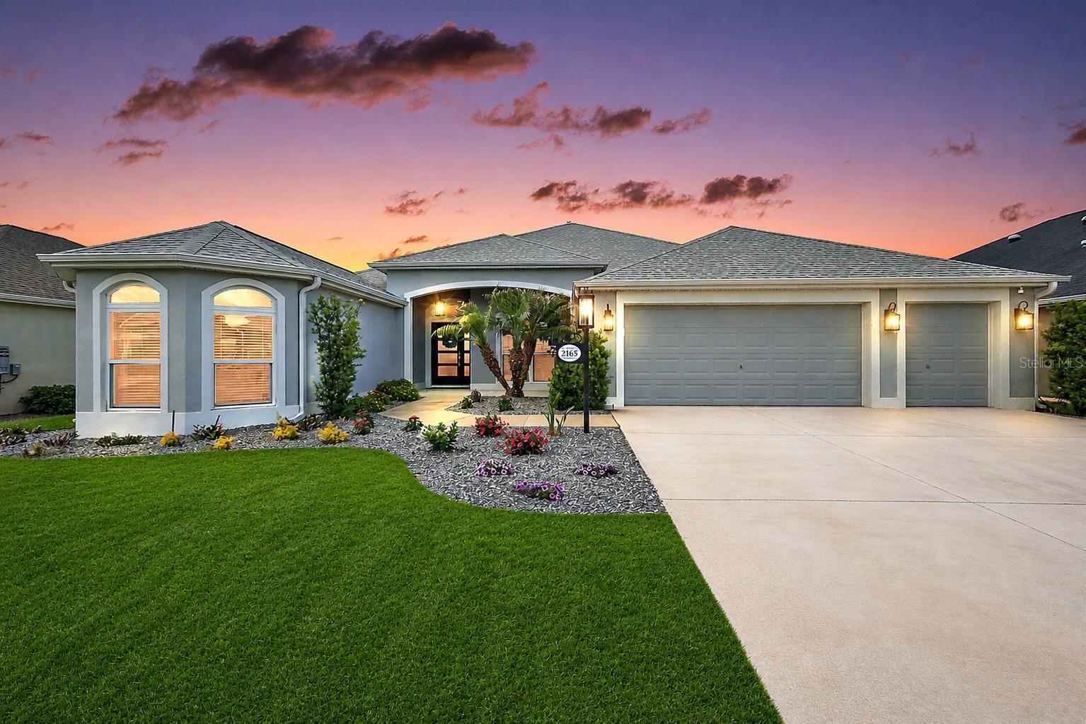 One or more photo(s) has been virtually staged. POOL & HOT TUB READY | ROOM FOR A GRAND PIANO | GOLF COURSE WITH POND VIEWS

2165 Gordon Path is an ideal fit for the buyer who wants a more spacious, flexible, and view-oriented Villages home than the standard resale option. With golf course frontage, pond views, generous indoor living space, a north-facing lanai, and future pool or hot tub potential, this ultra-expanded Woodside Designer offers a rare combination of comfort, setting, and lifestyle flexibility.

For the buyer who wants to create a true Florida outdoor lifestyle, a T&D Pools site plan is included with the listing attachments, confirming ample room for a custom swimming pool or hot tub. Set along the 3rd hole of Longleaf Golf Course, the home captures layered golf course and pond views, while the desirable north-facing lanai supports comfortable outdoor enjoyment without harsh afternoon sun.

Inside, the home is well-suited for buyers who value space, flow, and flexibility. Originally designed as a 4-bedroom model, this Woodside was built with the optional expanded great room layout, creating an open and elegant main living area with room for larger furniture, entertaining, hobbies, or even a baby grand or grand piano.

The home offers 3 bedrooms, 3 baths, 2,581 square feet of heated living space, and 3,895 total square feet under roof. Tile flooring runs throughout, creating a clean and cohesive finish, while the custom stone fireplace-ready feature wall and mantel add warmth, character, and a more refined feel than standard resale inventory.

The 2-car garage plus dedicated golf cart garage makes daily life in The Villages easier, whether heading to golf, dinner, recreation, shopping, or nearby conveniences. Located in the Village of McClure, the home is especially well-suited for the buyer who wants to be close to Everglades Plaza, minutes from Brownwood Paddock Square, and strategically positioned between Brownwood and the rapidly emerging Eastport and Middleton districts.

For the buyer seeking solid block and stucco construction, premium golf course frontage, pond views, pool potential, generous interior space, flexible living, and long-term Southern Villages convenience, 2165 Gordon Path offers a rare and highly functional combination.

Bond balance: $26,612, approximately $1,903 annually / $159 monthly.