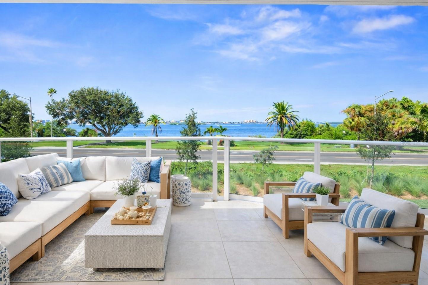 Luxury living at Serena by the Sea with 23,000+ SF of resort-style amenities! Residence #103, elevated above street level, is a unique 2 Bedroom + Den, 2.5 Bathroom unit boasting intracoastal water views, 3 exposures (South, West, and North), and conveniently located on the amenity level with private gate offering direct access from one of its THREE private terraces to the pool deck with outdoor amenities including the resort-style saltwater pool, jacuzzi, outdoor shower, fire pit lounge, summer kitchens, cabanas, dog run, and more. This 2,268 SF corner unit features an open kitchen with top-of-the-line Gaggenau appliances including gas cooktop, wine cooler, French door refrigerator integrated within the Italian cabinetry, dishwasher, and more, including remote-controlled motorized window shades on all windows. The luxurious Master Suite features two private terraces, walk-in closet with custom built-ins, and En Suite Bathroom with double vanity, glass enclosed dual shower, and separate soaking tub. Second Bedroom Suite features access to west facing terrace, en suite bathroom, and walk-in closet with custom built-ins. A Family Room/Den offers additional living space perfect for a home office, and a Powder Room ideal for guests, plus in-unit laundry room. This unit also comes with 2 reserved parking spaces and a storage unit. Other building amenities include 24/7 concierge, gym, social room & lounge, billiards and card tables, catering kitchen, and Spa with massage room, hair salon, sauna, second jacuzzi, locker room, and more. Must see!