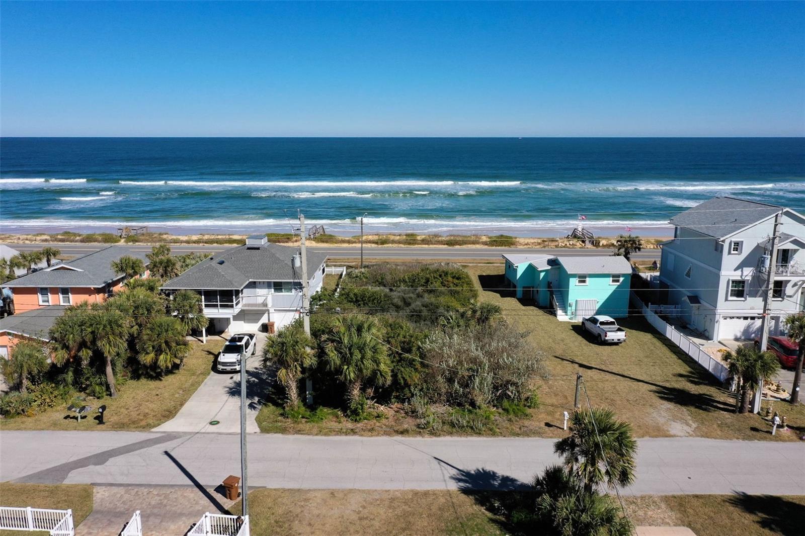 Wonderful lot located on N Ocean Shore BLVD in Flagler Beach offering unobstructed ocean views. The lot extends from Ocean Shore BLVD to N. Central Ave, meaning your driveway and garage can enter from the rear, leaving the front available to create amazing ocean views. A local builder has offered to build a nicely appointed, 2,500 L.S.F home with concrete pillars and include high impact glass and code compliant features for $899,000 which is a total of $1,399,000 for a home/lot package or bring your own builder - a great value. Call for details and plans. Flagler Beach is on fire and ocean front lots are disappearing fast!