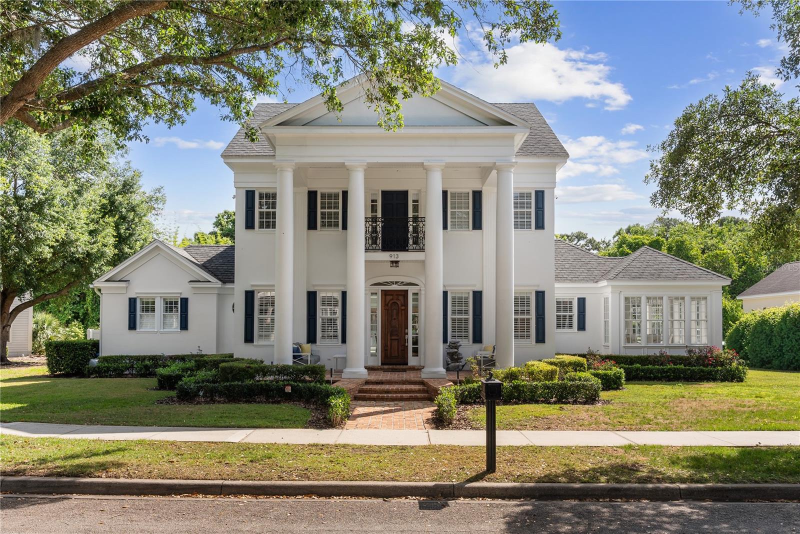 Some addresses in Celebration carry weight. West Park Drive is one of them.
Set on over a third of an acre along one of Celebration's most coveted tree-lined streets, this fully renovated 6-bedroom, 6.5-bath estate delivers nearly 5,300 square feet of air-conditioned living — thoughtfully designed, impeccably finished, and ready to be lived in at the highest level.
This is not a cosmetic refresh. Every detail of this home was reimagined with intention — from the gourmet kitchen appointed with Viking and Sub-Zero appliances, gold Calacatta quartz countertops, white shaker cabinetry, and a wine refrigerator, to the spa-inspired bathrooms finished in Carrara marble with Lefroy Brooks fixtures. The lighting selections, the flooring, the ceiling heights — every element was chosen to elevate the everyday.
The first floor primary suite is its own sanctuary. Accessed through French doors, it opens into an expansive bedroom with soaring ceilings, a sitting room, and a walk-in owner's closet that commands its own moment. Five additional ensuite bedrooms offer the flexibility today's luxury buyer demands — home office, fitness studio, guest quarters, or all of the above.
The floor plan is open, airy, and bathed in natural light. Professionally curated paint selections and premium flooring create an environment that is simultaneously sophisticated and deeply livable — a rare balance in homes of this size.
Step outside and the estate continues to deliver. The Carrara marble pool deck surrounds a sparkling pool and spa, open-air with the screen removed for unobstructed views of the conservation area behind. A custom pergola and full summer kitchen make this backyard a genuine extension of the home's entertaining capacity. Seamless indoor-outdoor flow is achieved through expansive backyard sliding glass doors that dissolve the boundary between the two. No rear neighbors. No overhead power lines. Pure privacy.
From the front porch, views of the Robert Trent Jones Sr. and Jr. Golf Course frame your mornings, and Celebration's legendary sunsets close your evenings.
The oversized 3-car garage and long driveway provide ample parking for family and guests alike. Downtown Celebration — with its acclaimed restaurants, boutique shopping, and waterfront gathering spaces — is minutes away on foot or by bike.
Within 15 minutes: Orlando International Airport. Within minutes: Magic Kingdom, EPCOT, Hollywood Studios, Animal Kingdom, and Disney Springs. Top-rated Celebration schools. High-speed internet. Master-planned community infrastructure at its finest.