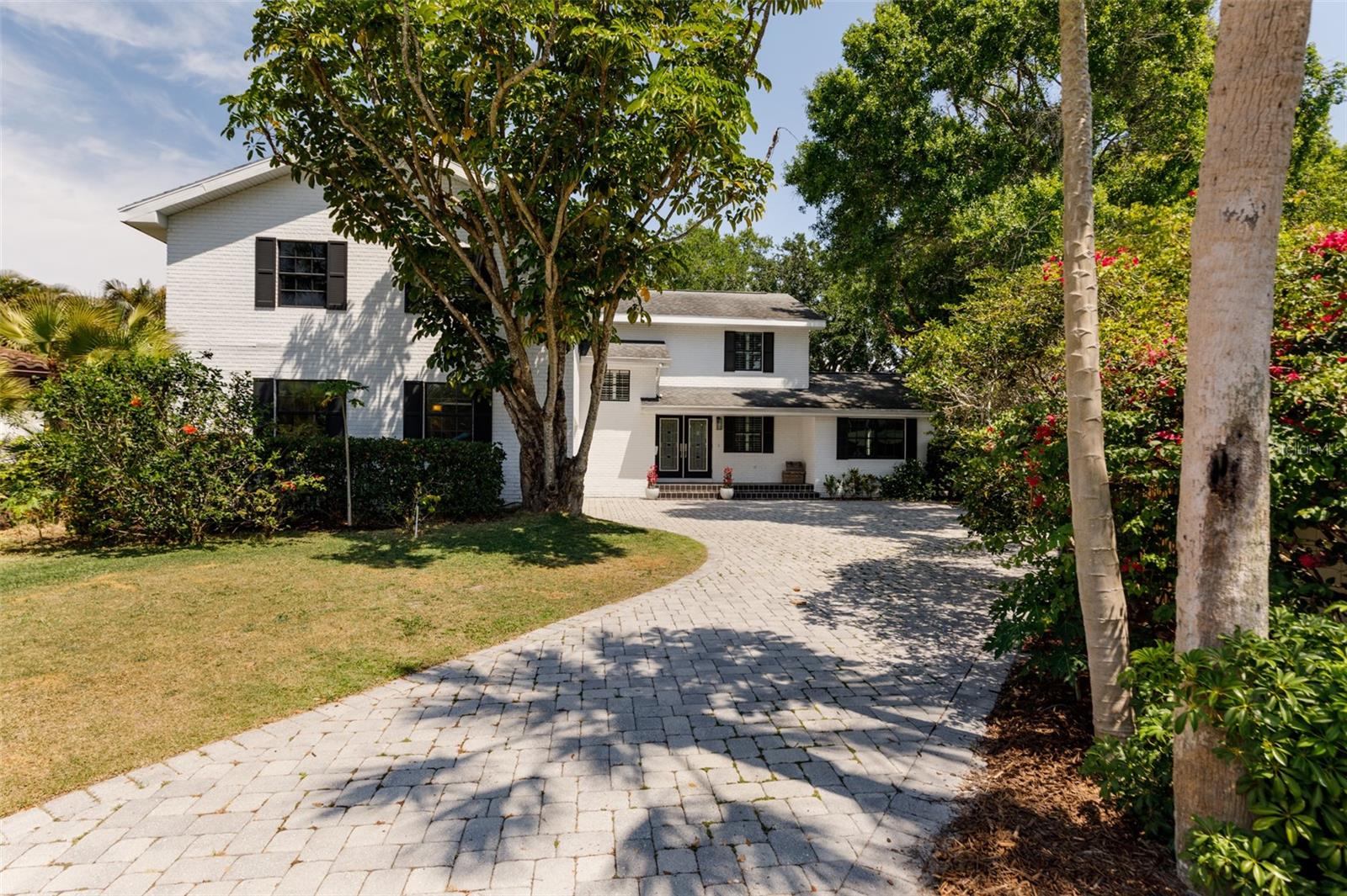 Nestled on a quiet cul-de-sac in the waterside neighborhood of Beach Park Isle in South Tampa, this 5 bedroom, 3.5 bath pool home features a spacious floor plan and private backyard, ideal for entertaining. The first floor offers a light-filled, open living and dining room, a recently renovated kitchen, featuring a generous island with ample seating, that is a wonderful gathering place for meals and conversation. The kitchen also includes granite counter tops, stainless steel appliances and opens to a family room.  Sliding glass doors open onto the covered back porch and generous sized pool.  An updated half bath, laundry room, and den with sliding glass doors that open to the backyard complete the first floor. Upstairs you will find the large master suite with a walk-in closet and an ensuite bathroom. Additional features include a new roof 2023, refinished hardwood floors in the living spaces, plantation shutters throughout and a side entry 2 car garage. Beach Park Isles neighborhood is conveniently located to many of the extensive amenities in South Tampa, including numerous dining and shopping options, Tampa Airport, Mabry Elementary, Coleman Middle and Plant High School.