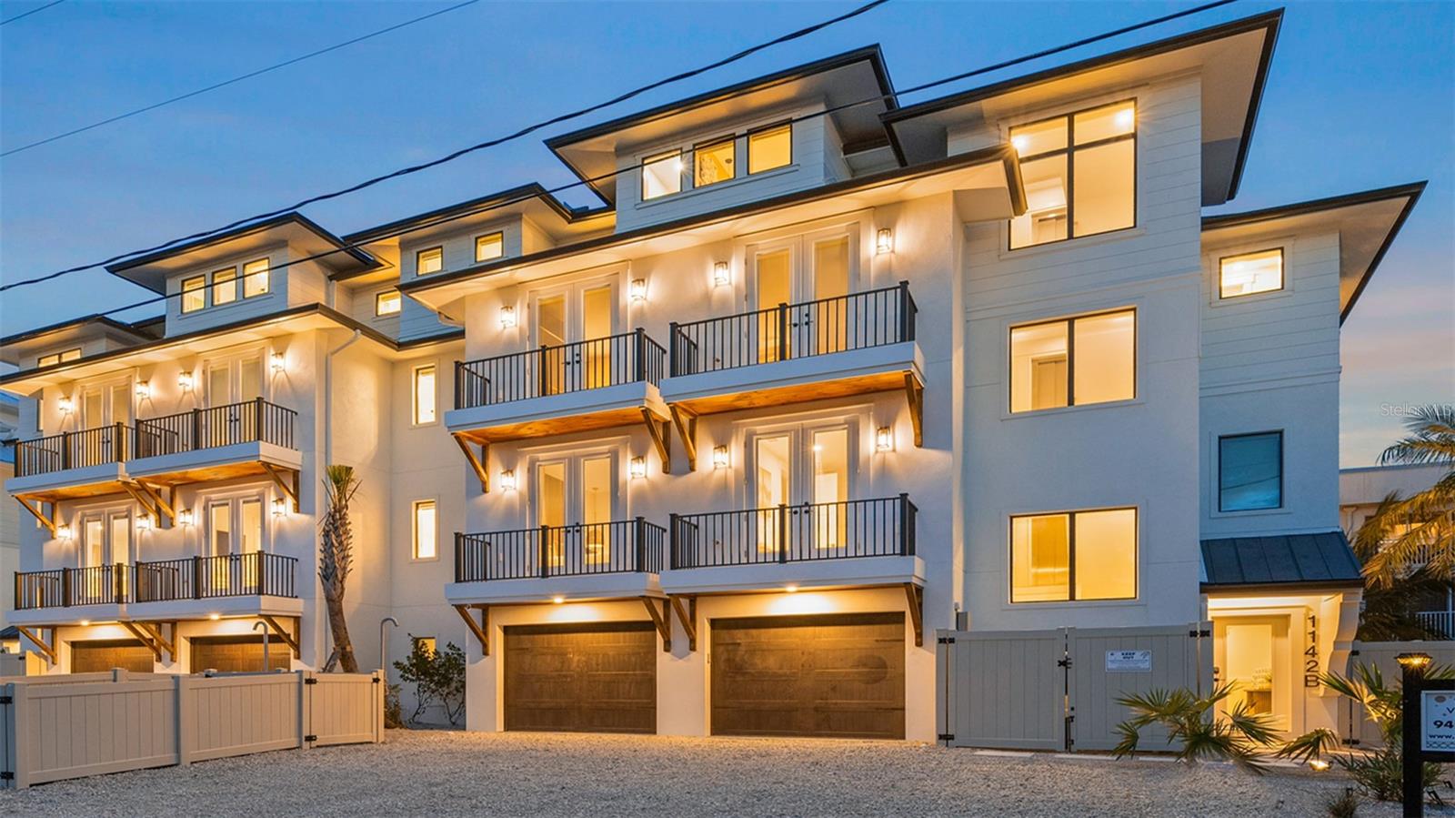 There is only one — Golden Set. 
Some residences embrace their surroundings. Others become an extension of them. 
Golden Set invites the island in—rich woods, woven textures, botanical motifs, and warm metallic accents establish a residence that feels both worldly and deeply rooted in Siesta Key.  
Your legacy, engineered for a lifetime of stories at a scale only you could imagine. This private resort centers around a breathtaking saltwater pool within its fully fenced backyard. Cross the sun shelf to the swim-up bar or unwind beneath the custom rock waterfall and built-in slide. Host championship matchups of pool volleyball or basketball, perfect your short game on the putting green, or dine alfresco beneath covered seating with multiple televisions and a state-of-the-art outdoor kitchen. 
Inside, nearly 3,600 square feet unfold across multiple levels connected by a private elevator. The great room serves as the social heart of the home – an exceptional setting for gatherings while the chef’s kitchen supports your culinary imagination. Festivities transition effortlessly from the expansive living and dining areas onto the terrace, blending the boundary between indoor elegance and outdoor paradise. 
The upper levels are devoted to privacy in four en-suite guest rooms and multiple viewing balconies. At the pinnacle of the residence lies its most exclusive destination. A well-appointed club room, complete with a half bath, creates an elevated entertainment hub, while the rooftop terrace, perched 50 feet above the island, is the final expression - sunrise over Siesta Key, long afternoons beneath the island sun, and evenings illuminated by the fading glow of the Gulf horizon.  
The secluded primary suite occupies the home's most private position, delivering breathtaking Gulf views, a spa-inspired bath, and the rare luxury of complete retreat. Here, your final view of the day is nothing short of spectacular. 
More than a home, Golden Set is part of an exclusive Vunique collection with a proven history of strong rental performance — each residence one-of-one, purpose-built to balance bold design and bespoke experience. Here, ownership transcends address; it becomes a mark of belonging to something beautifully uncommon.