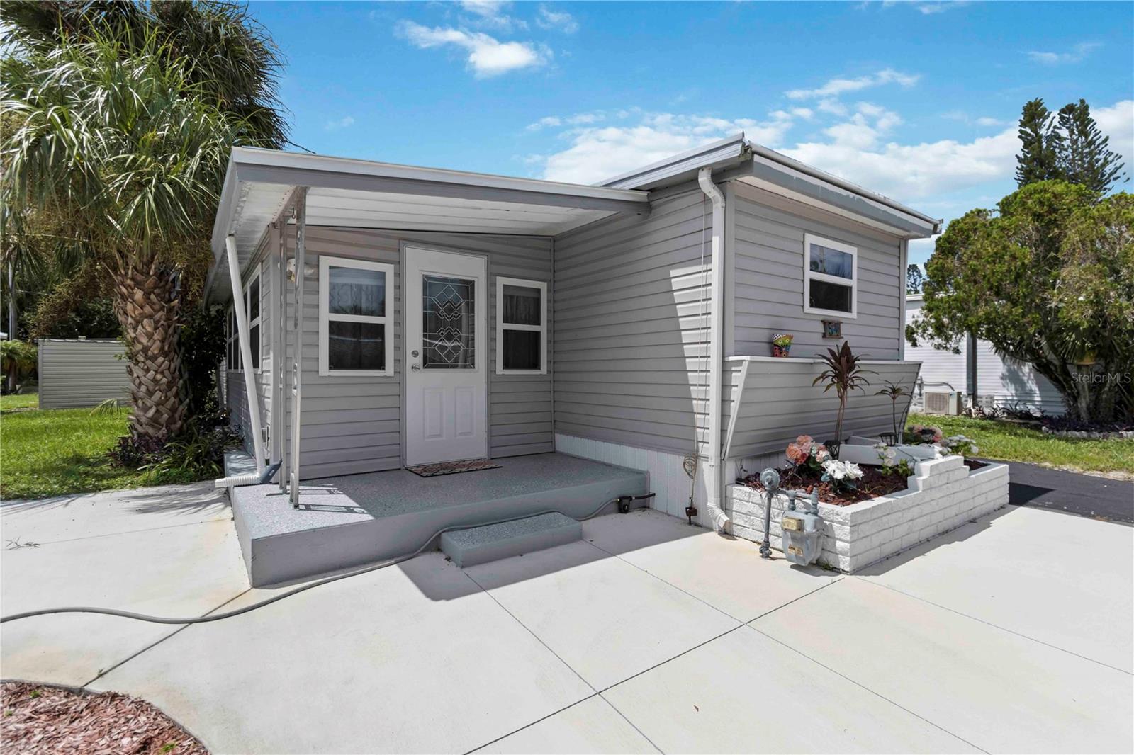 Better Than New — Fully Renovated 55+ Home (Now Bigger Too!)

Move right into this beautifully renovated single-wide that lives like a double-wide. Completely updated from the ground up for low-maintenance, modern living in a friendly 55+ community—ideal for seasonal residents or anyone seeking an affordable, move-in-ready home.

Highlights:
- Converted lanai now conditioned living space (˜232 sq ft) with lounge and additional bedroom  
- Gourmet kitchen: stainless range, microwave, dishwasher, refrigerator, tiled backsplash, double sink, ample upper & lower cabinetry  
- Clerestory windows flood the interior with natural light  
- Durable laminate flooring throughout  
- Updated bath with tiled walk-in shower; stackable washer/dryer included  
- Primary bedroom with built-in wardrobes  
- Large outdoor shed(S) for beach gear and storage  

Location & Community:
- Club House plus heated and screened pool.
- 1 mile to Ringling Museum • 3.5 miles to downtown Sarasota • 6 miles to Lido Key • 10 miles to Siesta Key  
- Close to UTC Mall, Sarasota Farmers Market, restaurants, and cultural venues  
- Service/emotional support animals (ESA) welcome with board-approved accommodation

Enjoy stylish, affordable living in an unbeatable Sarasota location—perfect for seasonal escapes or year-round comfort. Schedule your showing today!