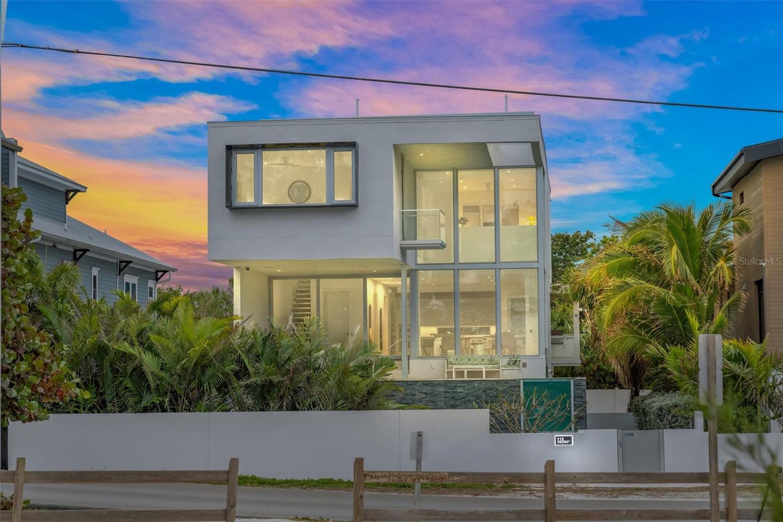Welcome to this stunning show stopping property on the North End of Anna Maria Island!  This is a 3 bedroom + office/den, 3.5 bathrooms and 3,548 sq ft. home featuring views from every enormous window of the Tampa Bay, Sunshine skyway bridge and the City Pier! This luxurious and meticulously designed property offers an unparalleled living experience, seamlessly blending modern amenities with breathtaking views.  Award winning home designed by renowned architectural firm, Halflants + Pichette, they feature very unique finishes including shell stone throughout the home, fully automated smart home, security system, automated shades, temperature, light and A/V controls and more!   As you walk through the open floor plan, you’ll notice the spacious layout, natural light and comfort the home brings.  All 3 bedrooms have their own ensuite bathroom for your convenience and privacy.  Additionally, there’s a versatile office room that could be turned into a fourth bedroom and currently also has a Murphy bed if desired.   The primary bedroom has gorgeous views of the Tampa Bay and City Pier, Lutron shades, large closets as well as a 5ft wide shoe closet!  Ascend to the rooftop retreat where the views get even better!  1,000 sq ft roof top deck includes a stainless steel jacuzzi, full outdoor kitchen, speakers, IPE decking and loungers to soak up the sun.  There is a 3-car garage and an elevator that goes to all 3 levels.  Take a dip in the sparkling heated pool that is elevated with a pool window or relax in the adjacent decks surrounded by lush landscaping and low maintenance artificial turf.  Conveniently located a block away from Pine Avenue and all it has to offer including restaurants, boutiques, ice cream shops and more! Don’t miss this wonderful opportunity and schedule your private showing today!