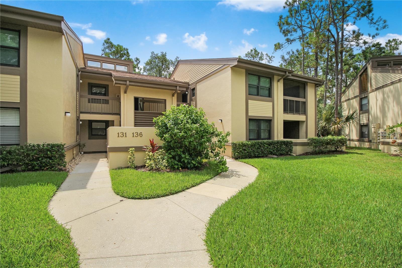 Virtually Staged. Welcome Home to this first floor 2 bedroom, 2 bath condo in Woodlake Run in East Lake Woodlands. Large open living/dining area with sliders to screen in Lanai. Kitchen off of dining area with lots of cabinets and breakfast bar seating. Covered porch off of the kitchen with laundry closet & washer/dryer. Large Primary Bedroom with adjoining bath, step-in shower, 2 closets and a slider to covered Lanai. 2nd Bedroom with slider to covered porch and adjacent bath features step-in shower. Great Location, community pool, golf courses, Shopping, Restaurants, Movie Theatre, County Parks, Beaches nearby.